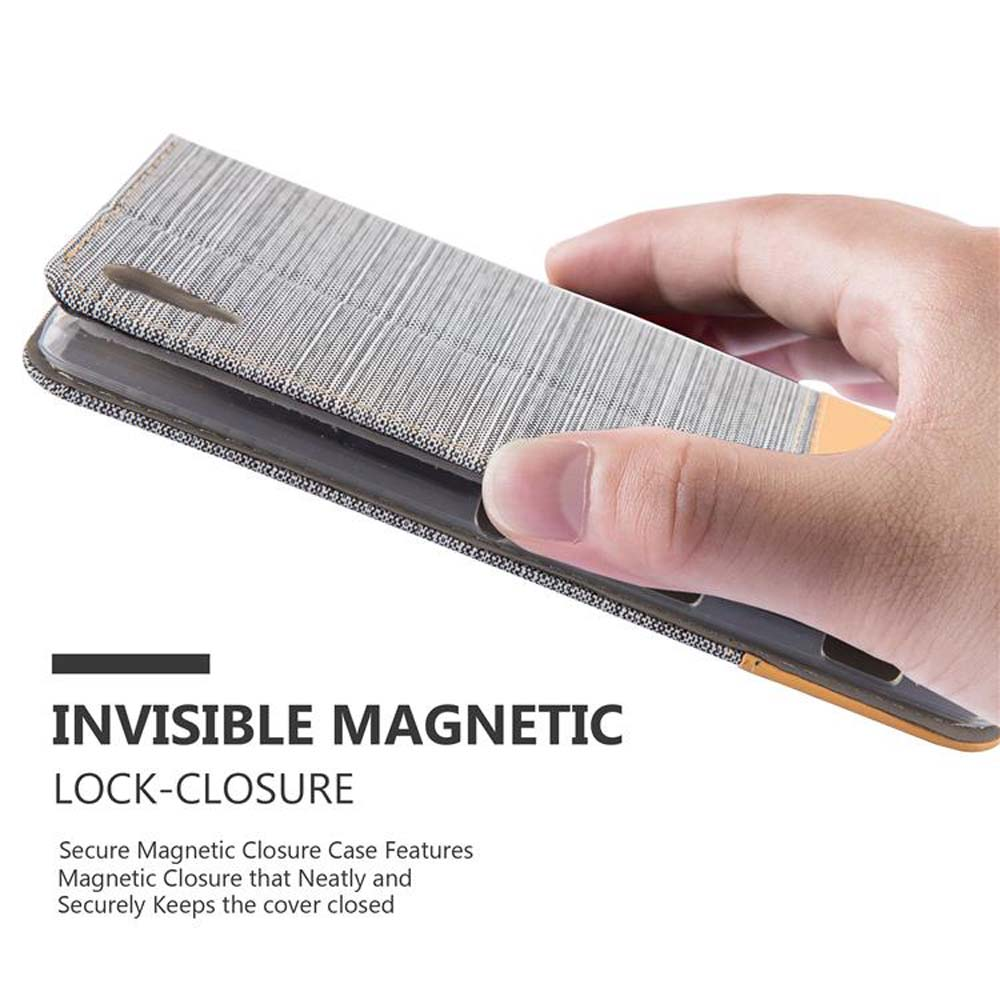 Mano sosteniendo una funda de teléfono gris abierta. Texto 'Invisible Magnetic Lock-Closure'. Fondo claro.