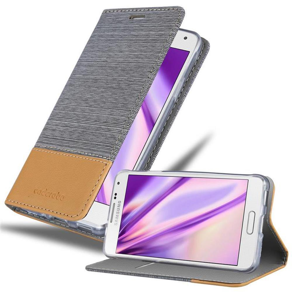 Graue und braune Handyhülle mit einem Telefon darin. Hülle ist offen, zeigt den Bildschirm.