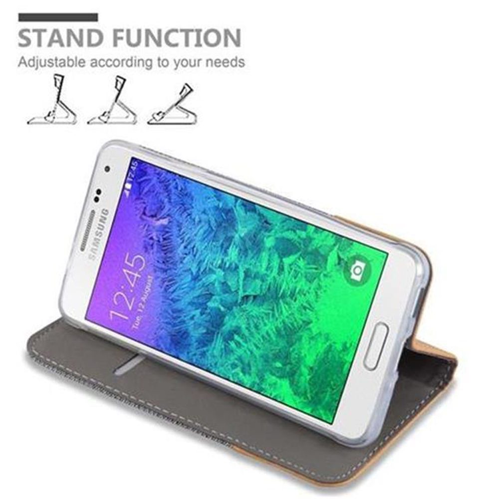 Ein Telefon in einer Hülle, aufgestellt. Bildschirm zeigt Apps, mit Text: STAND FUNCTION.
