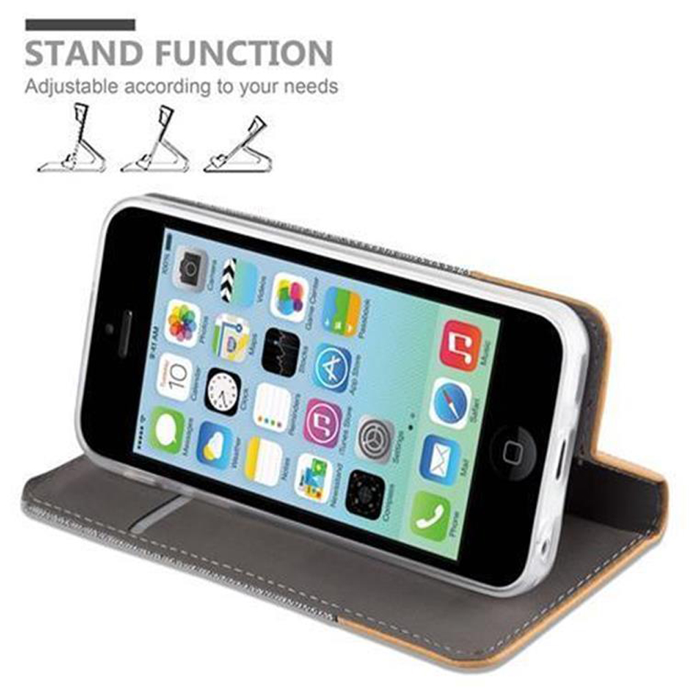 Teléfono en una funda abierta. La funda se puede usar como soporte. Texto: Función de soporte.