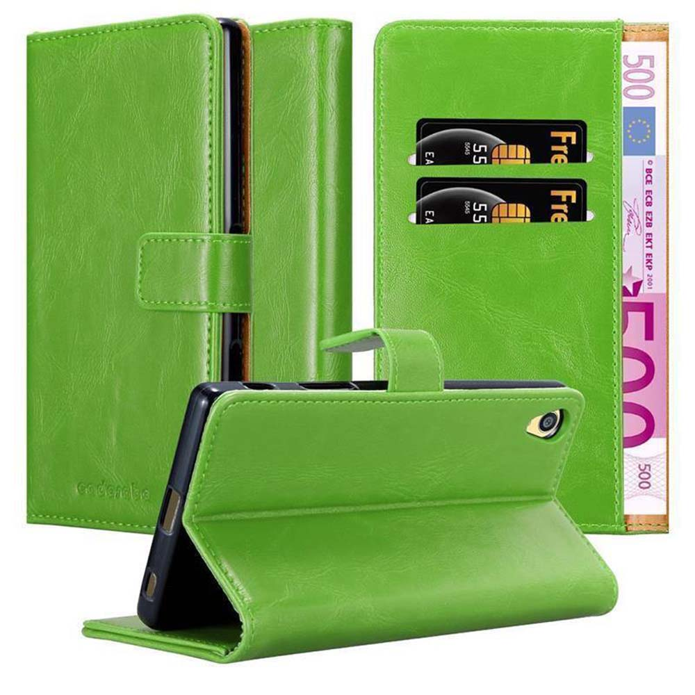 Funda verde para teléfono, abierta y cerrada, con tarjetas y efectivo. Fondo blanco.