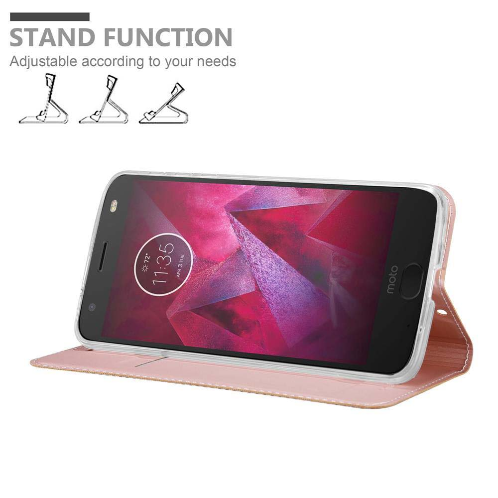 Una custodia rosa per telefono che può stare in piedi. Lo schermo del telefono mostra uno sfondo rosso e nero.