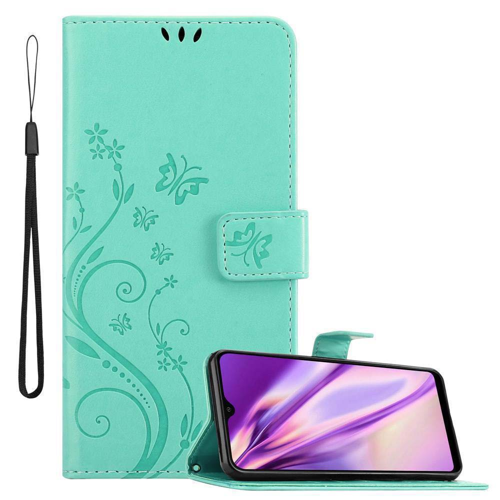 Una custodia per telefono verde acqua con design floreale e farfalla. Un telefono è visualizzato con uno schermo viola.