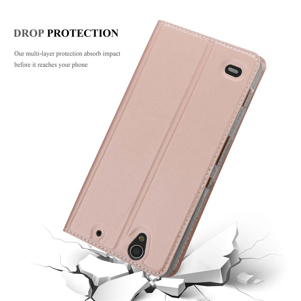 Handyhülle mit Telefon darin, fällt auf eine Oberfläche. Text 'Drop Protection'. Hellrosa Hülle.