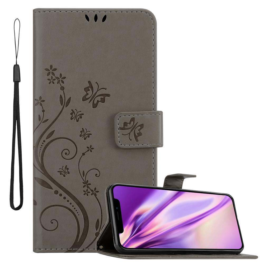 Graue Handyhülle mit floralem Design, hält ein Telefon mit lila Bildschirm.