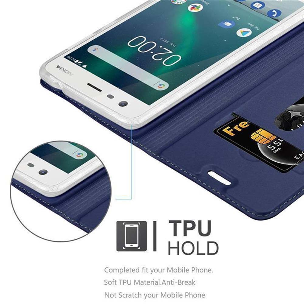 Ein Telefon in einem blauen Gehäuse liegt auf einem Tisch. Eine Karte ist eingesetzt. TPU HOLD.