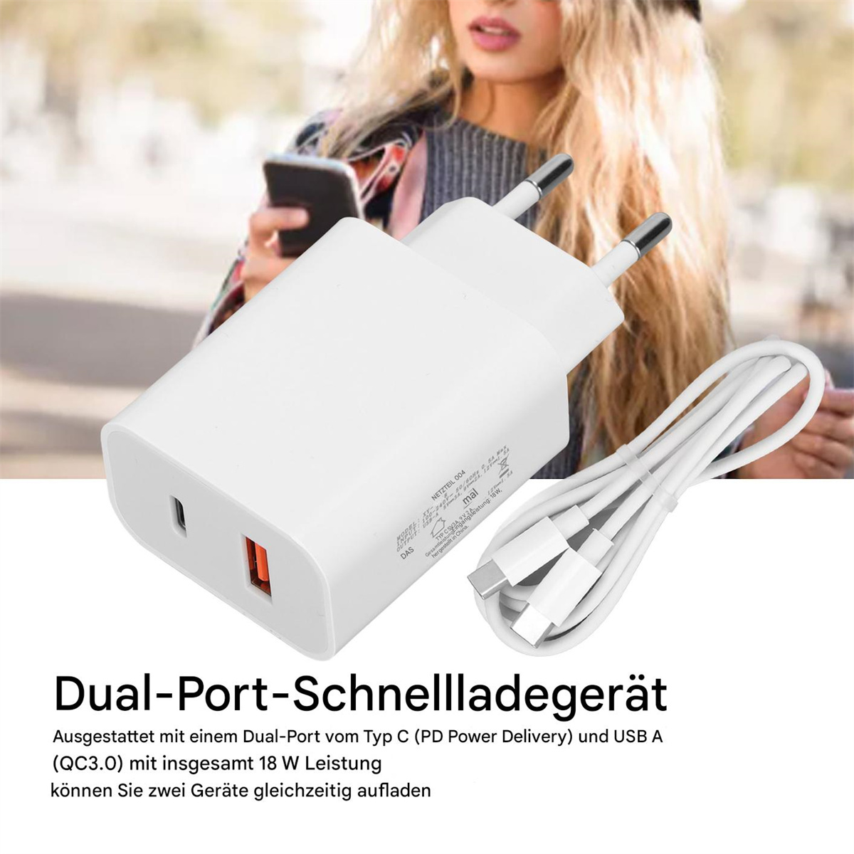Ein weißes und orangefarbenes Ladegerät mit zwei Anschlüssen und einem Kabel.