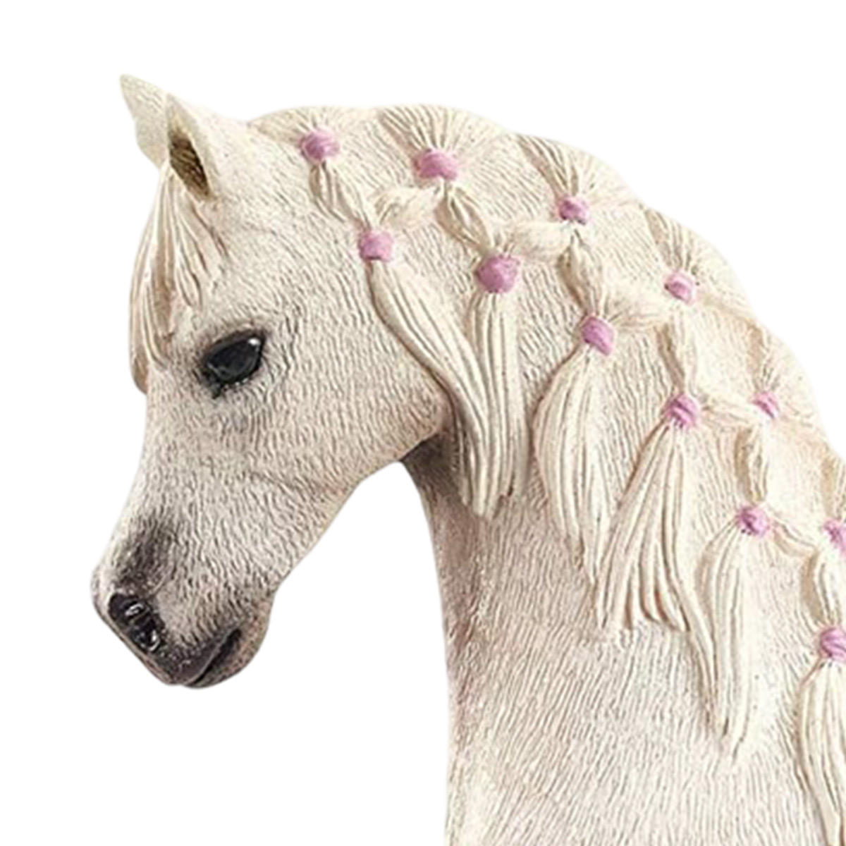 Una testa di unicorno bianca con una treccia decorata con nastri rosa.