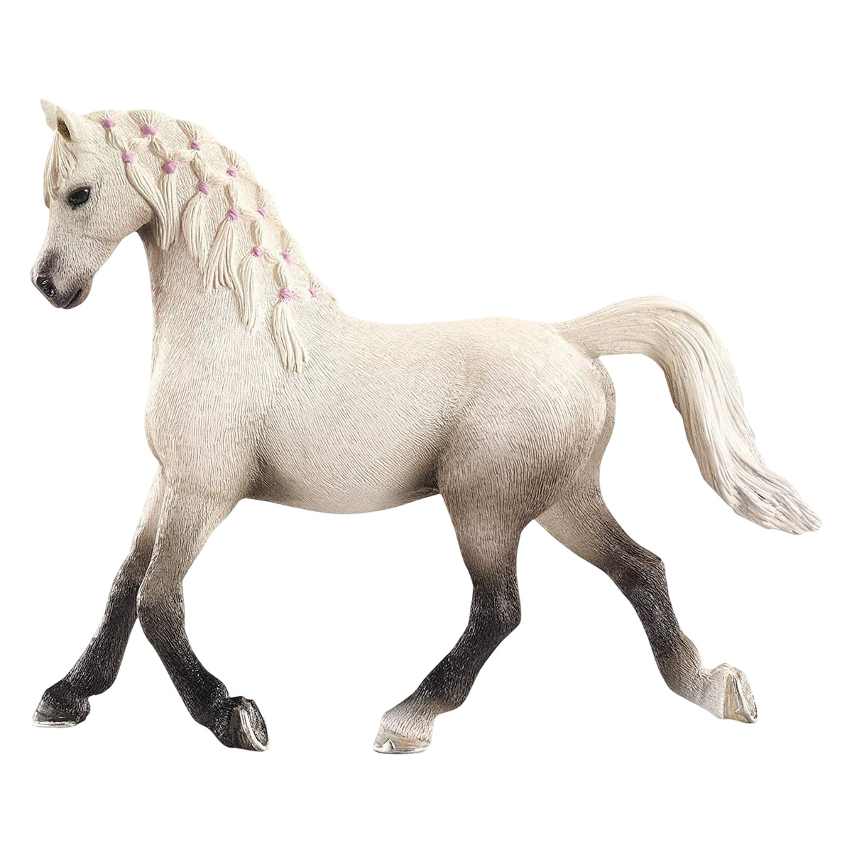 Cavallo giocattolo bianco con criniera e coda intrecciate rosa, posato su sfondo bianco.
