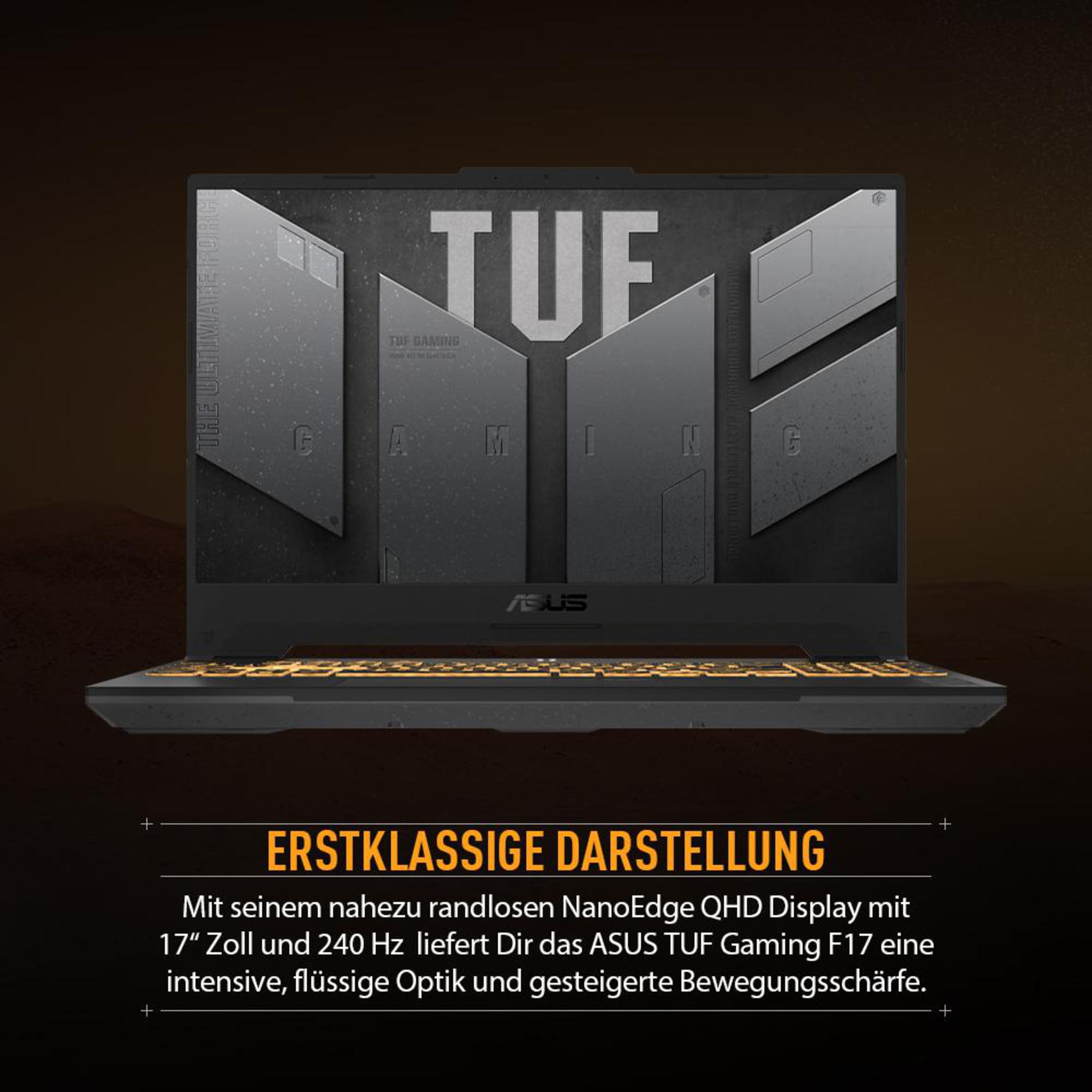 Ein schwarzer Laptop mit orangefarbenen Tastaturleuchten, beleuchtet in dunkler Umgebung.