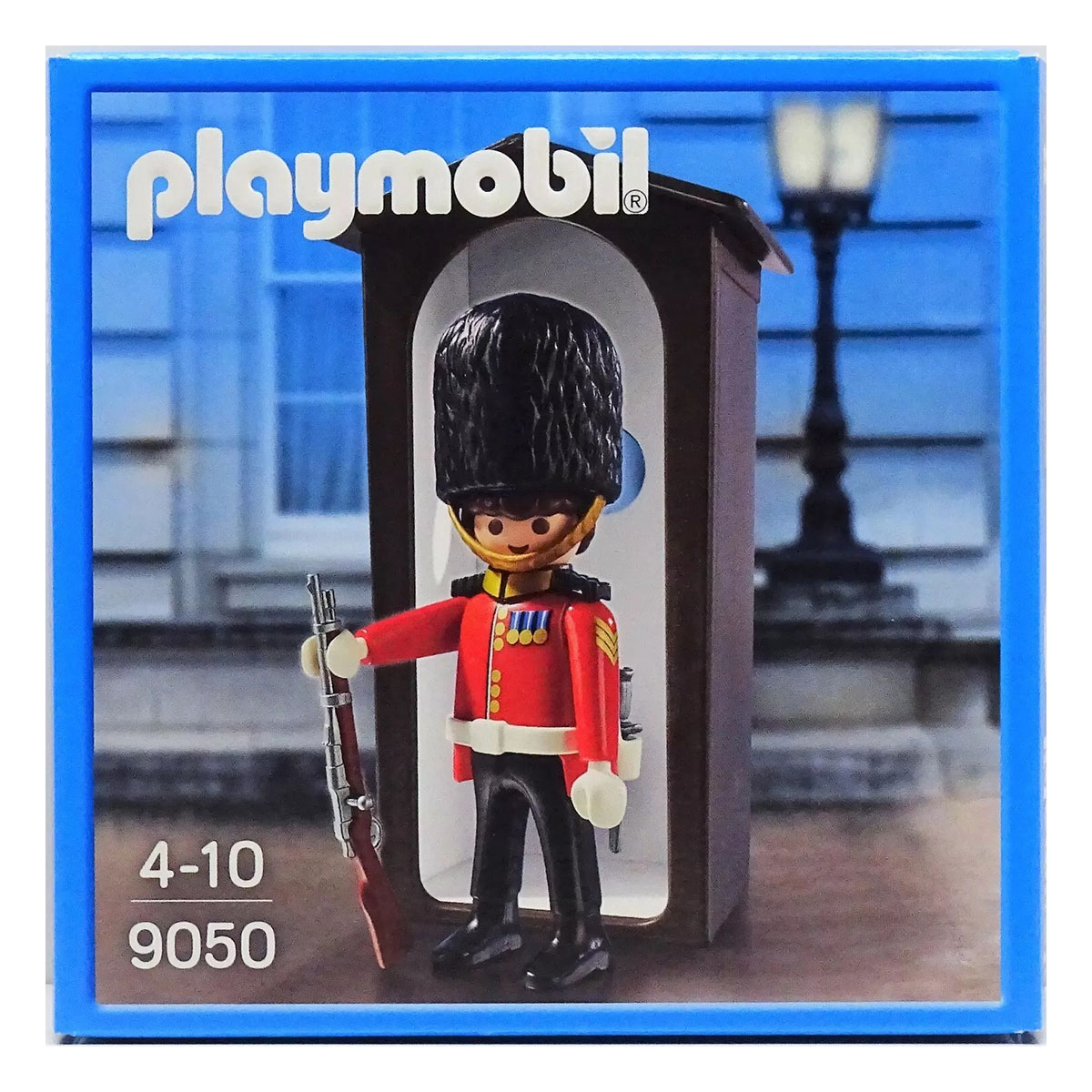 Soldatino Playmobil in una scatola blu. È una guardia reale in uniforme rossa e nera.