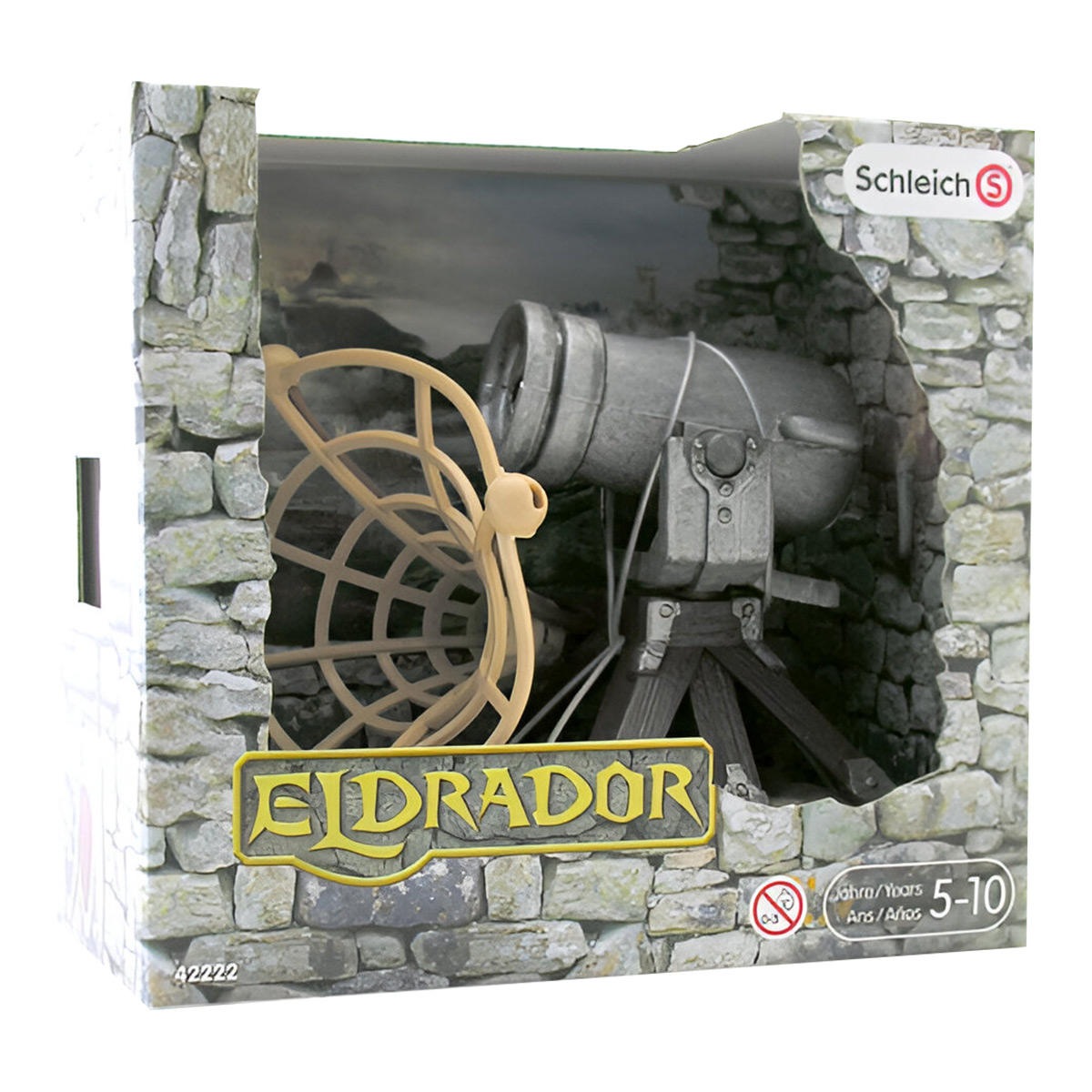 Un cannone giocattolo e una sfera armillare dentro una scatola. La scatola è etichettata 'Eldrador' e 'Schleich'.