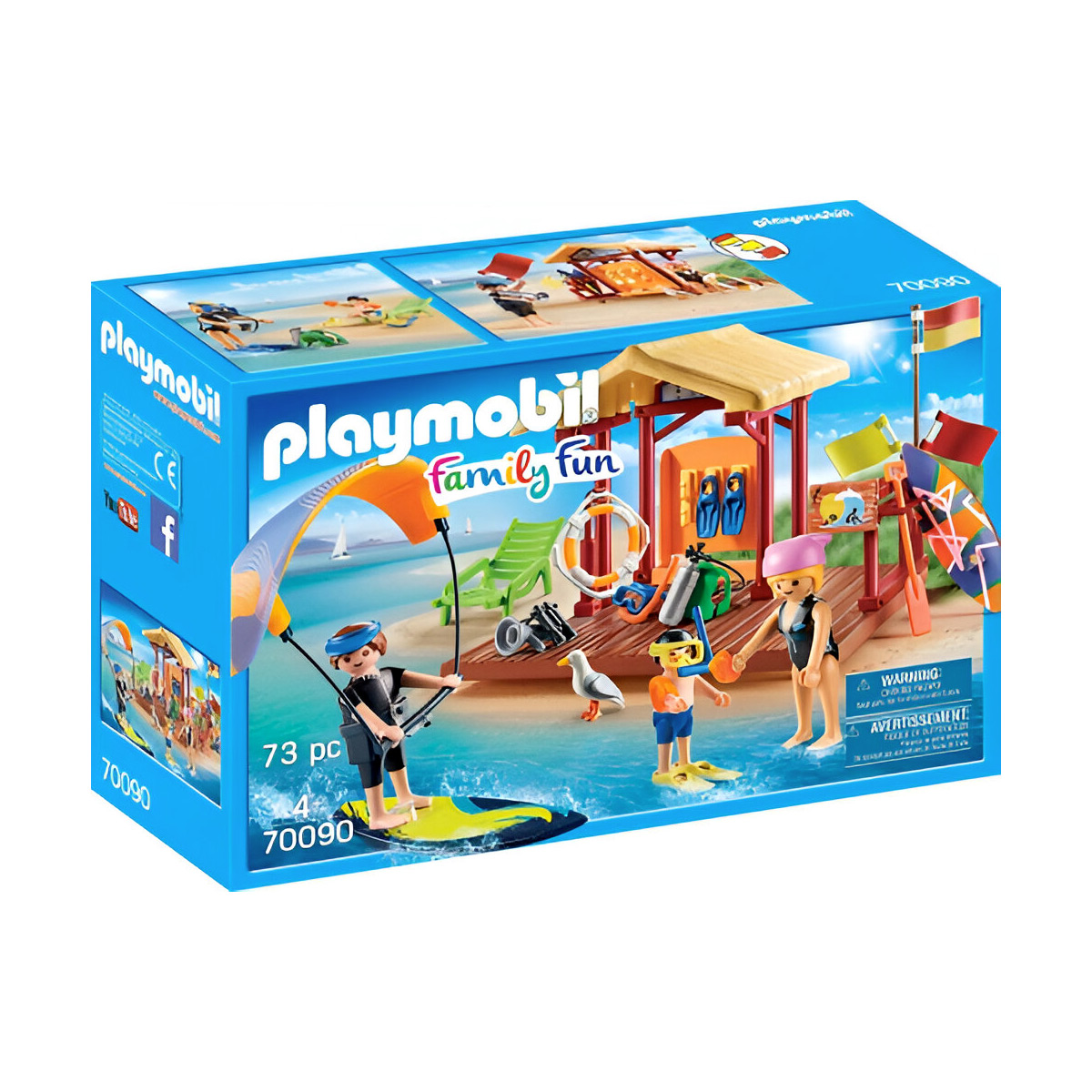 Playmobil set: strandscène met mensen, redderspost en accessoires. Blauwe doos met tekst.