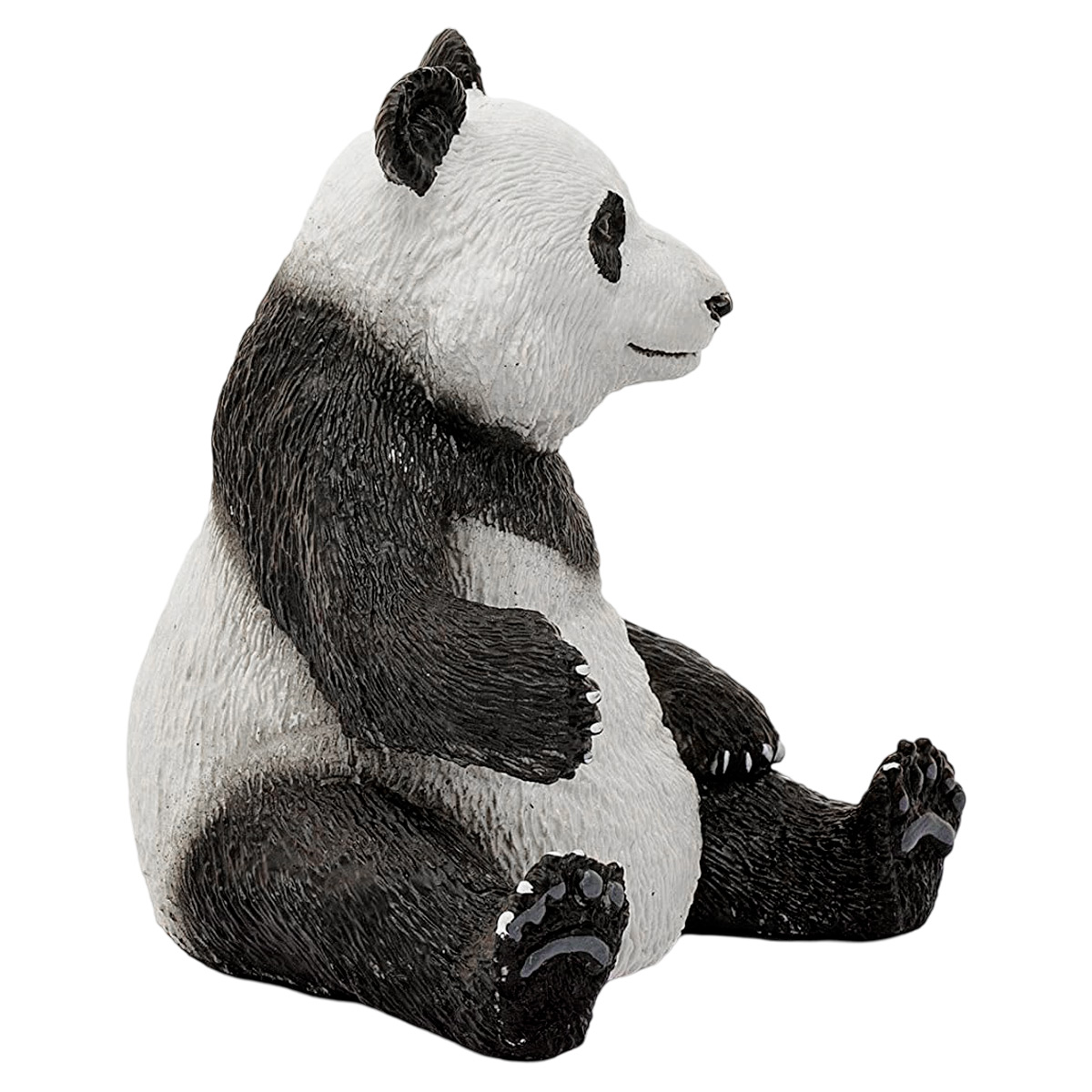 Panda-Bären-Figur. Schwarz und weiß, seitlich sitzend. Blickt nach rechts.
