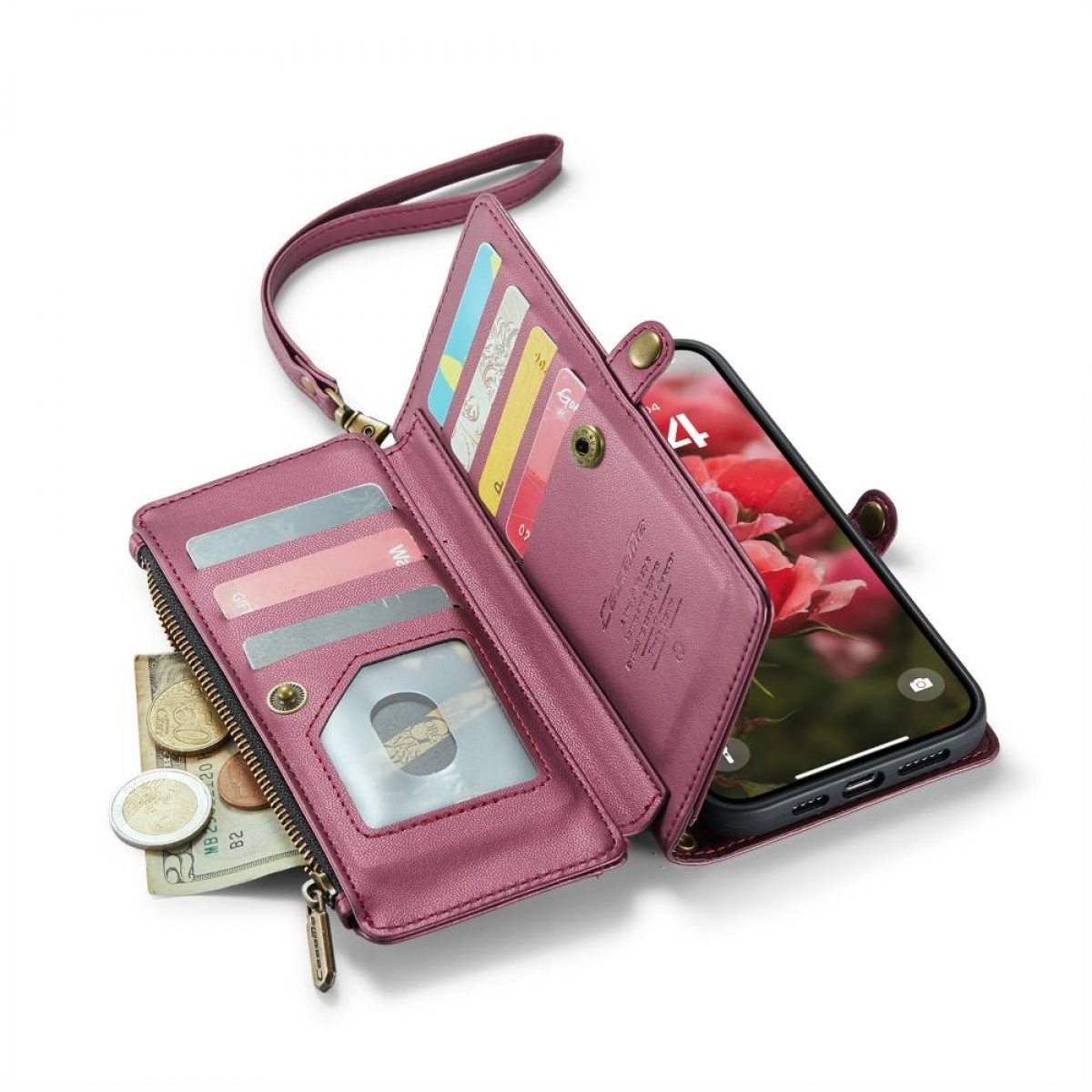Offene rosa Geldbörse mit Karten, Bargeld und einem Telefon. Der Hintergrund ist ein verschwommenes Blumenmuster.