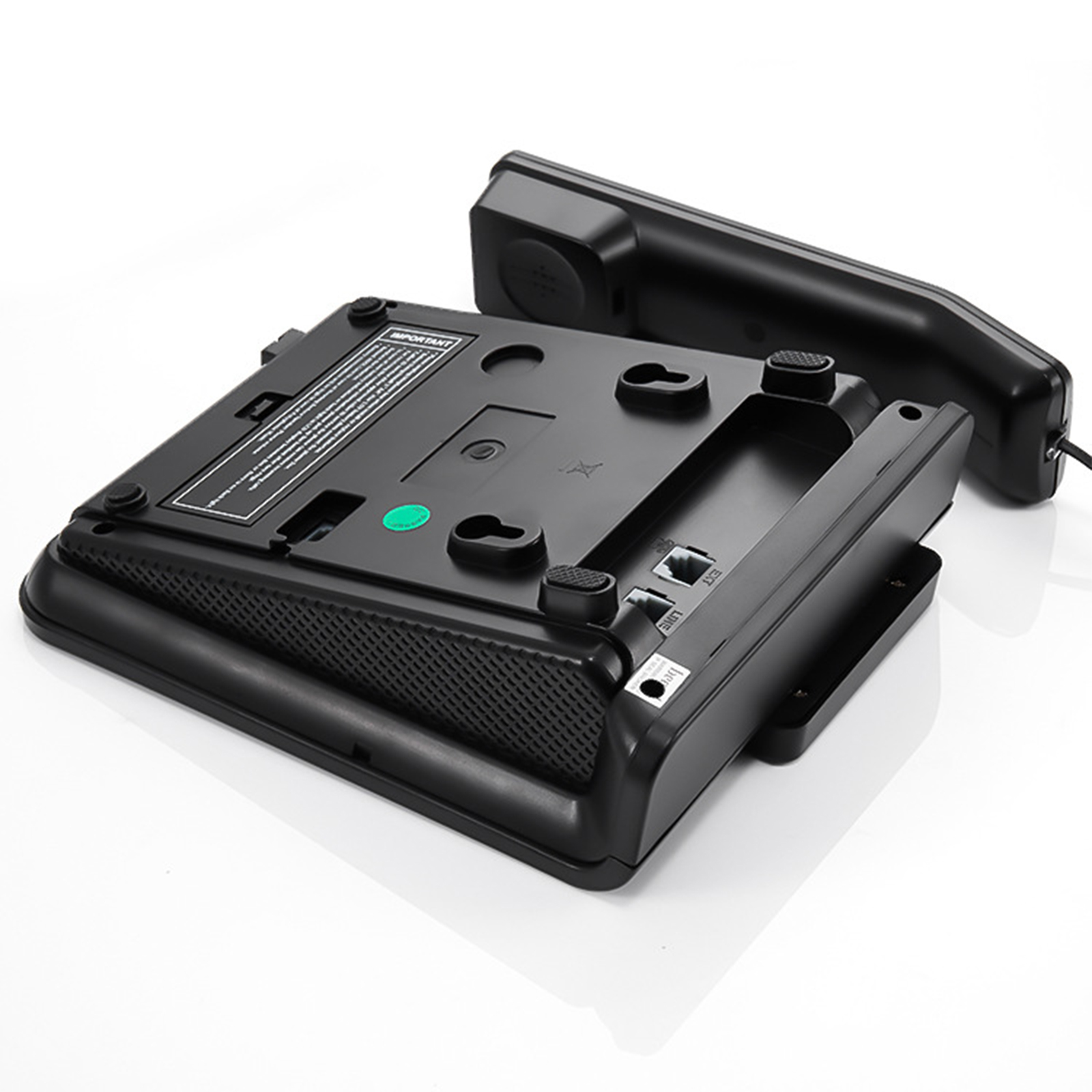 Schwarze Telefonbasis mit Hörer. Die Basis ist auf dem Kopf und zeigt die Unterseite.