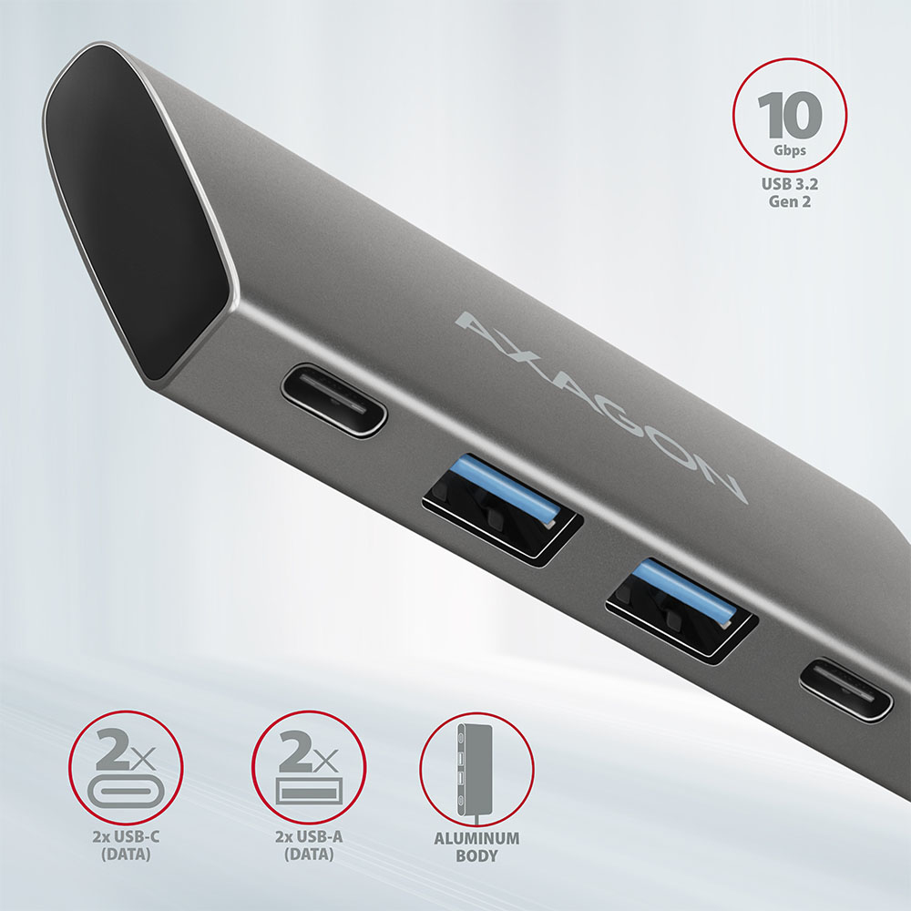 Primo piano di un hub USB argento con 2 porte USB-C e 2 USB-A. Corpo in alluminio.
