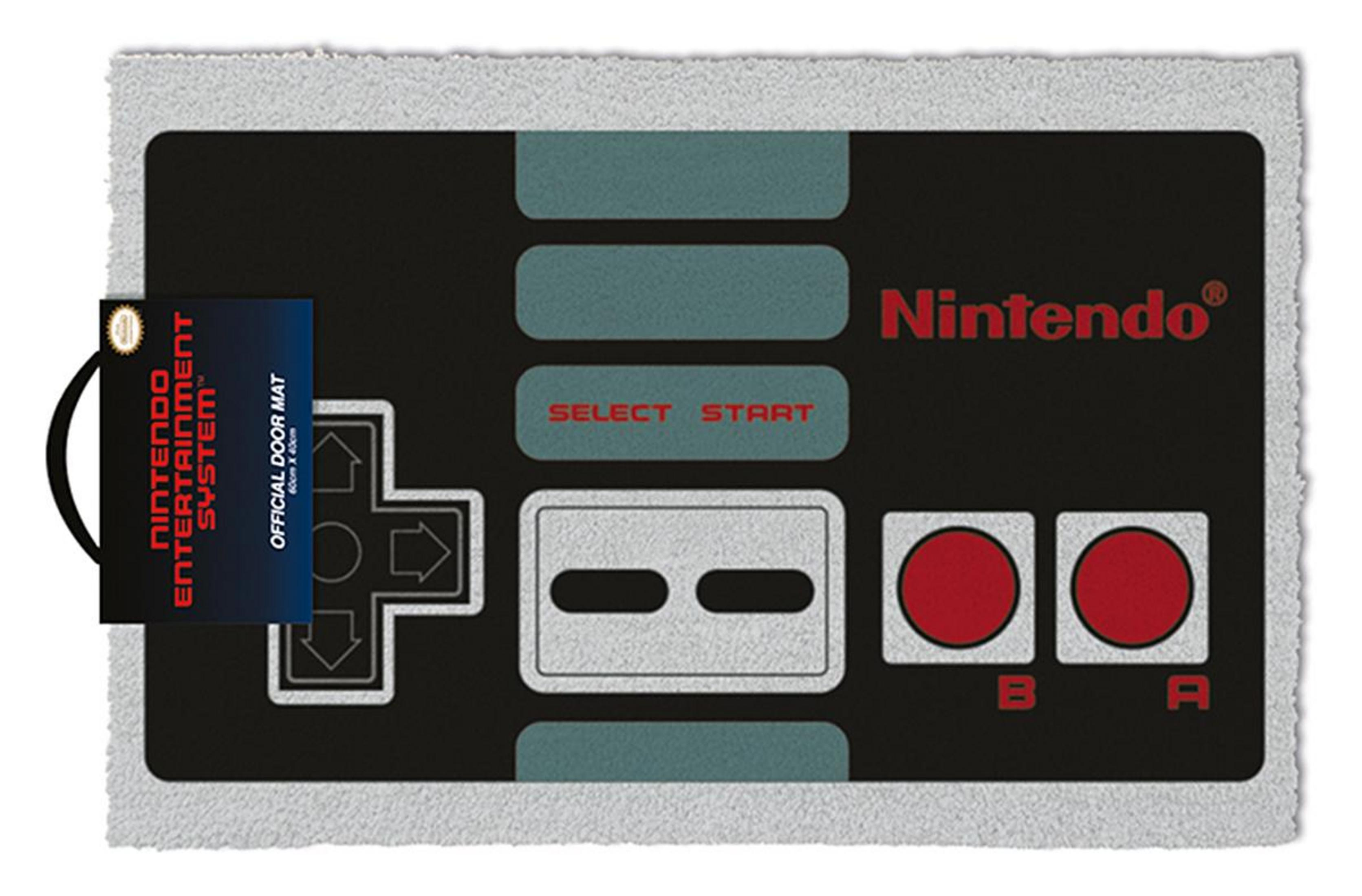 Una alfombra para puerta con diseño de mando de Nintendo con un diseño de mando de NES.