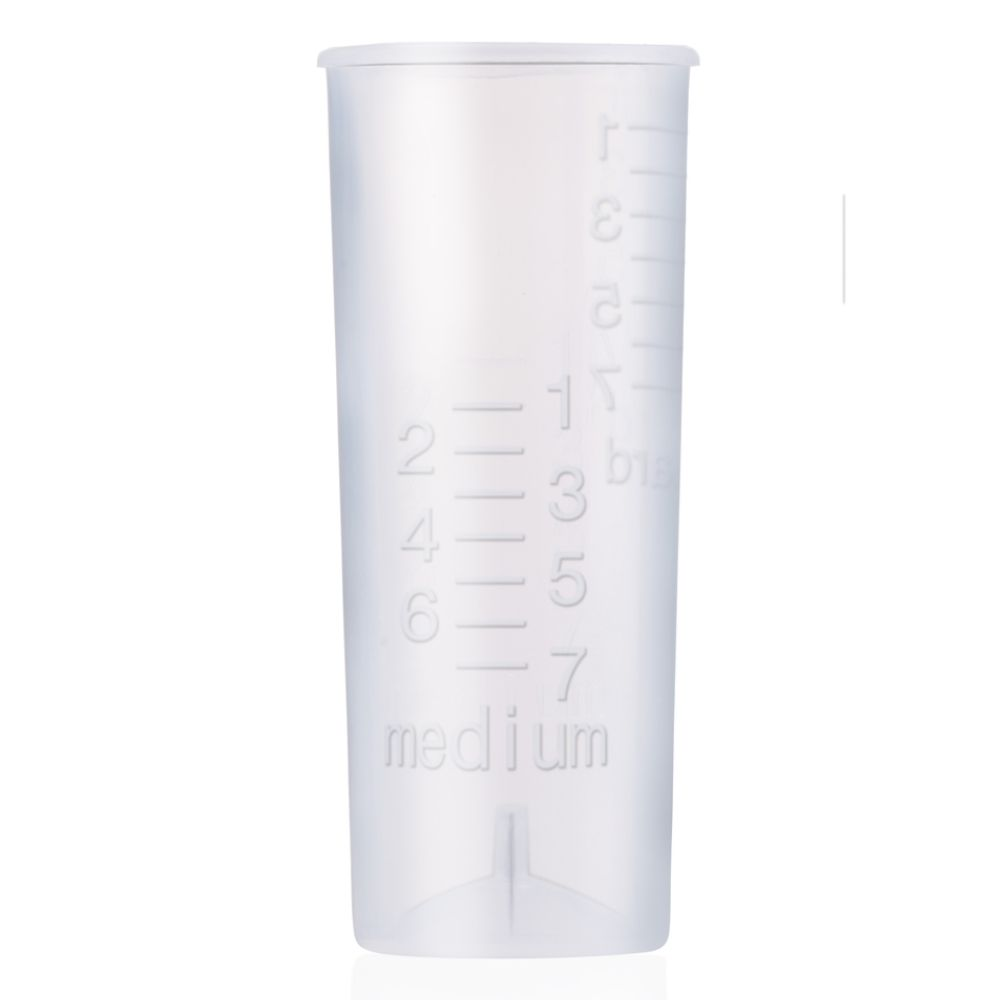 A clear plastic measuring cup with numeric markings and the word medium.
