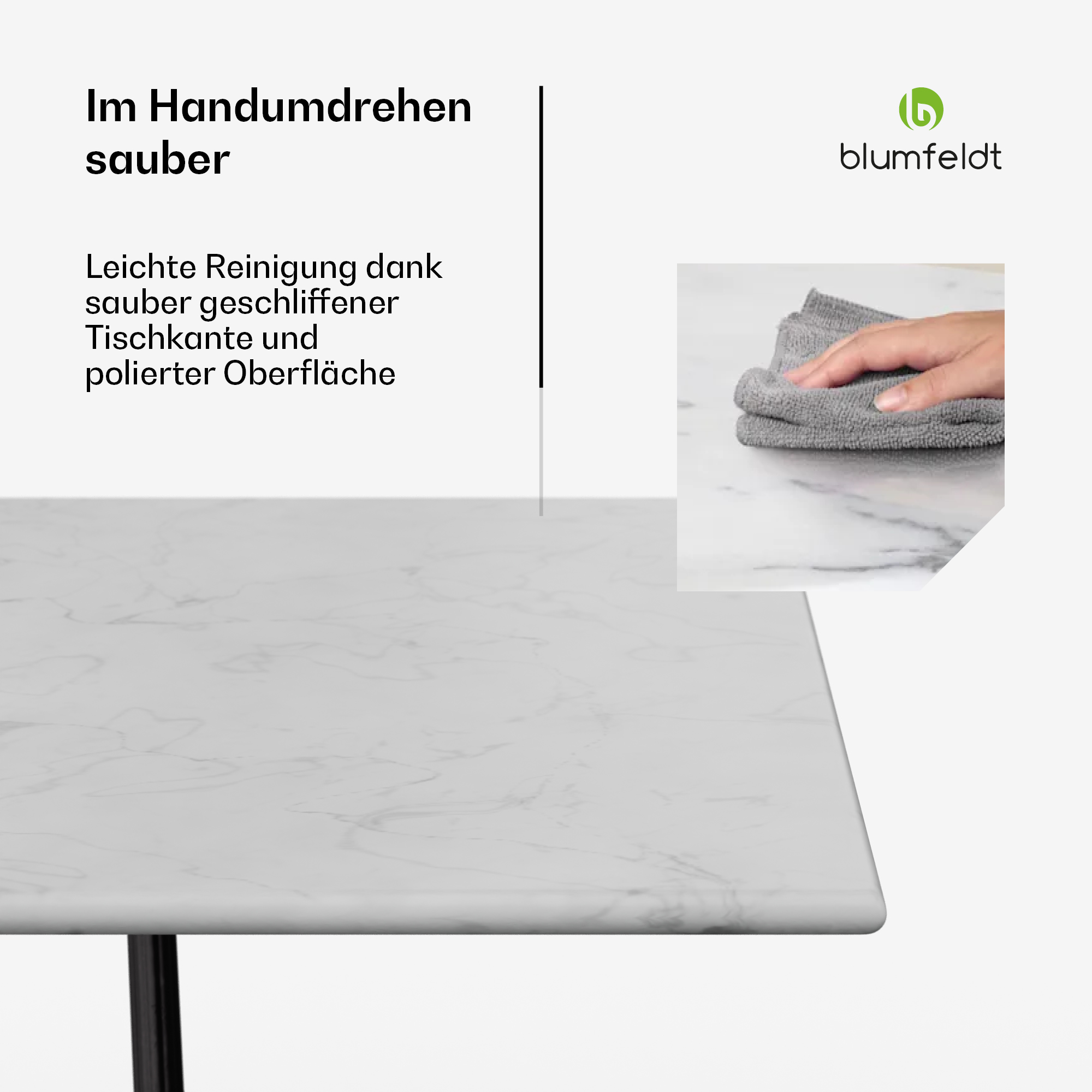 Weißer Tisch mit Marmormuster und grauem Tuch, mit einer Hand, die das Tuch hält.