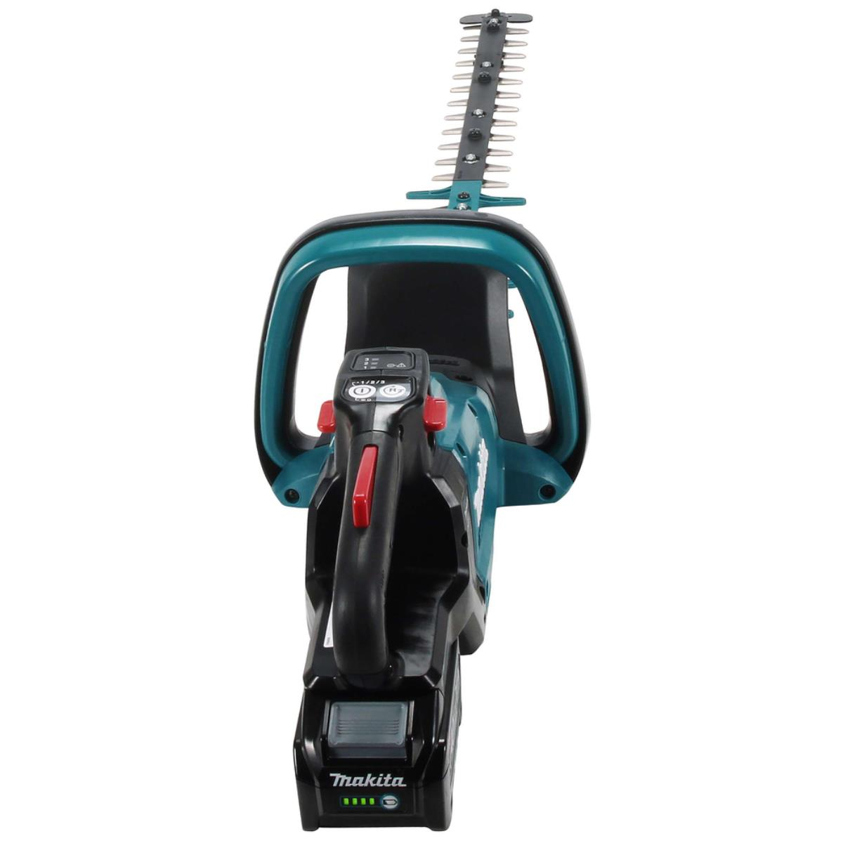 Makita Heckenschere. Türkis und Schwarz, roter Auslöser, Batteriefach.