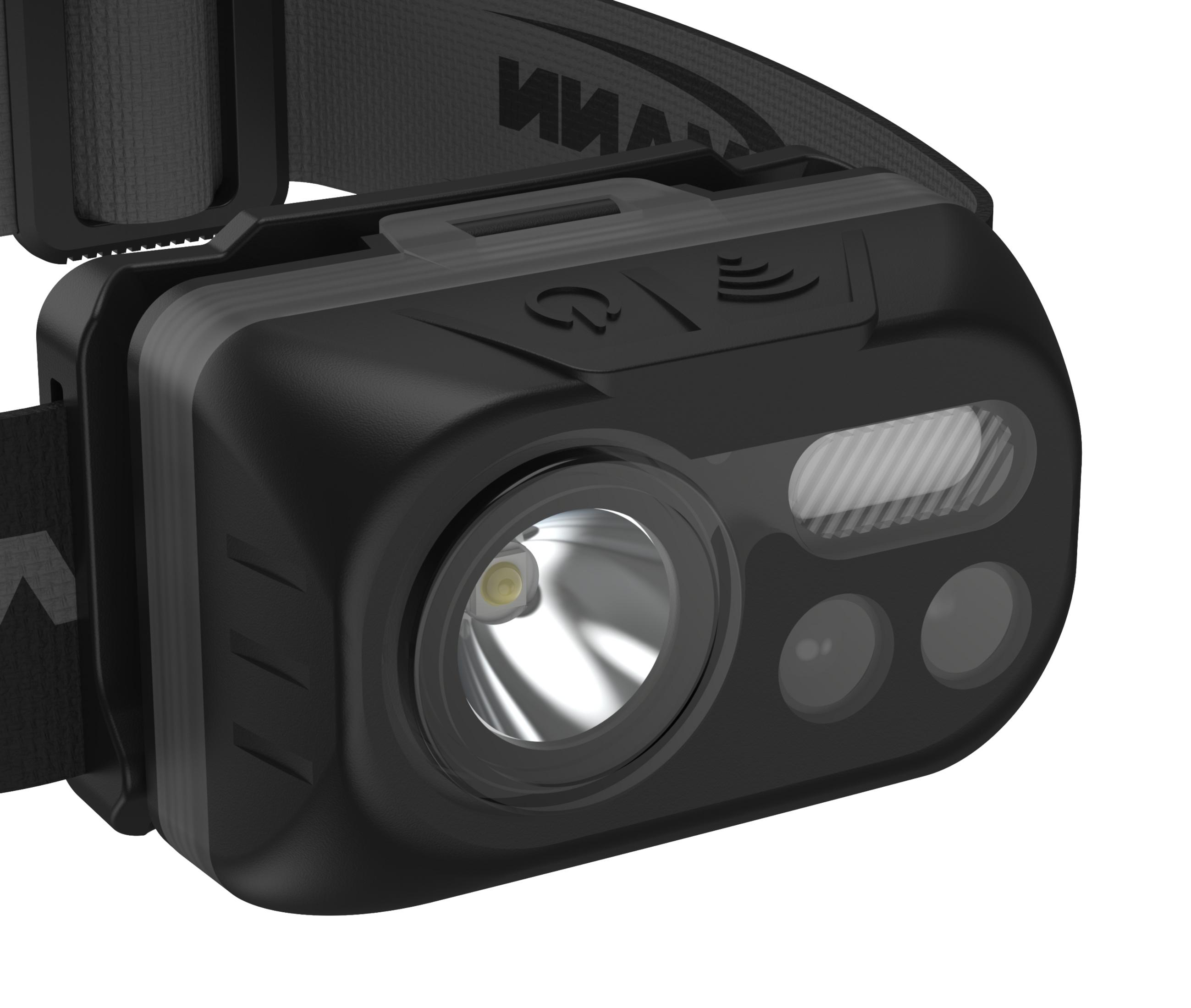 Czarna latarka czołowa z jasnym centralnym światłem na białym tle.