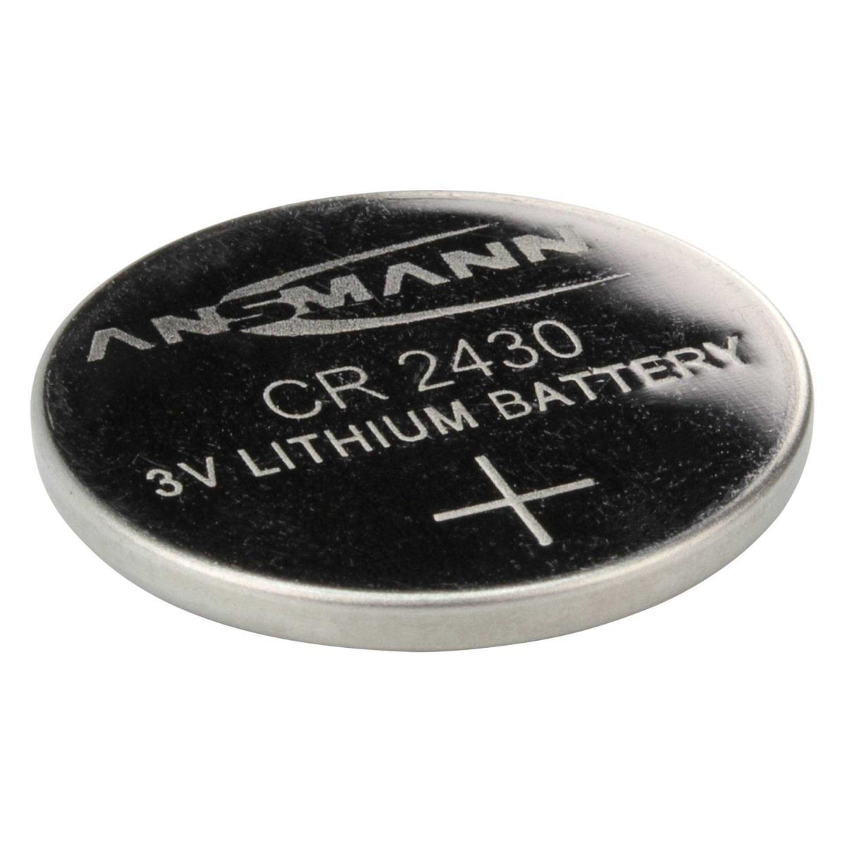 Okrągła srebrna bateria z napisem 'ANSMANN CR 2430 3V LITHIUM BATTERY' ze znakiem plus.