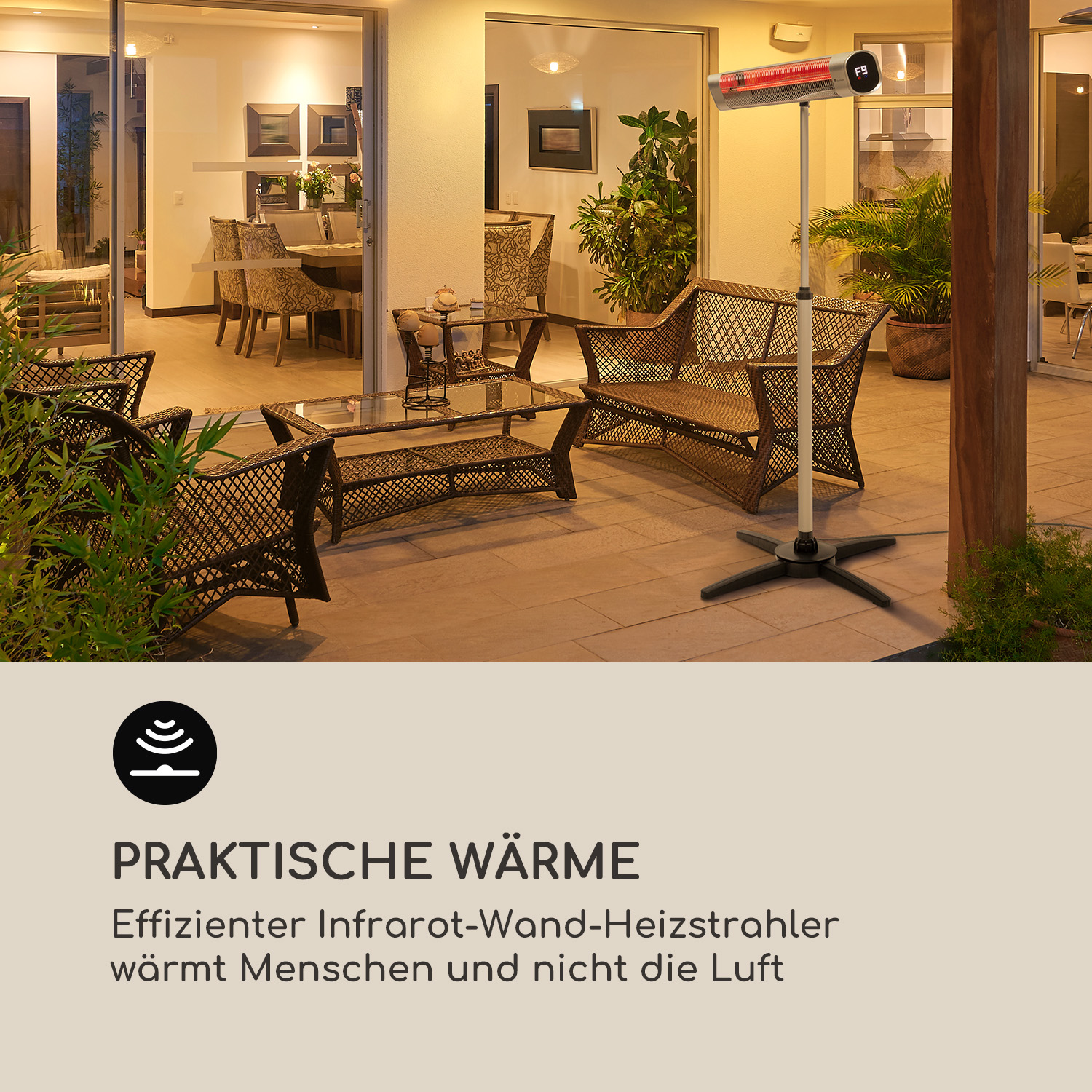 Eine Szene auf einer Außenterrasse mit einem Infrarot-Heizstrahler und Möbeln.
