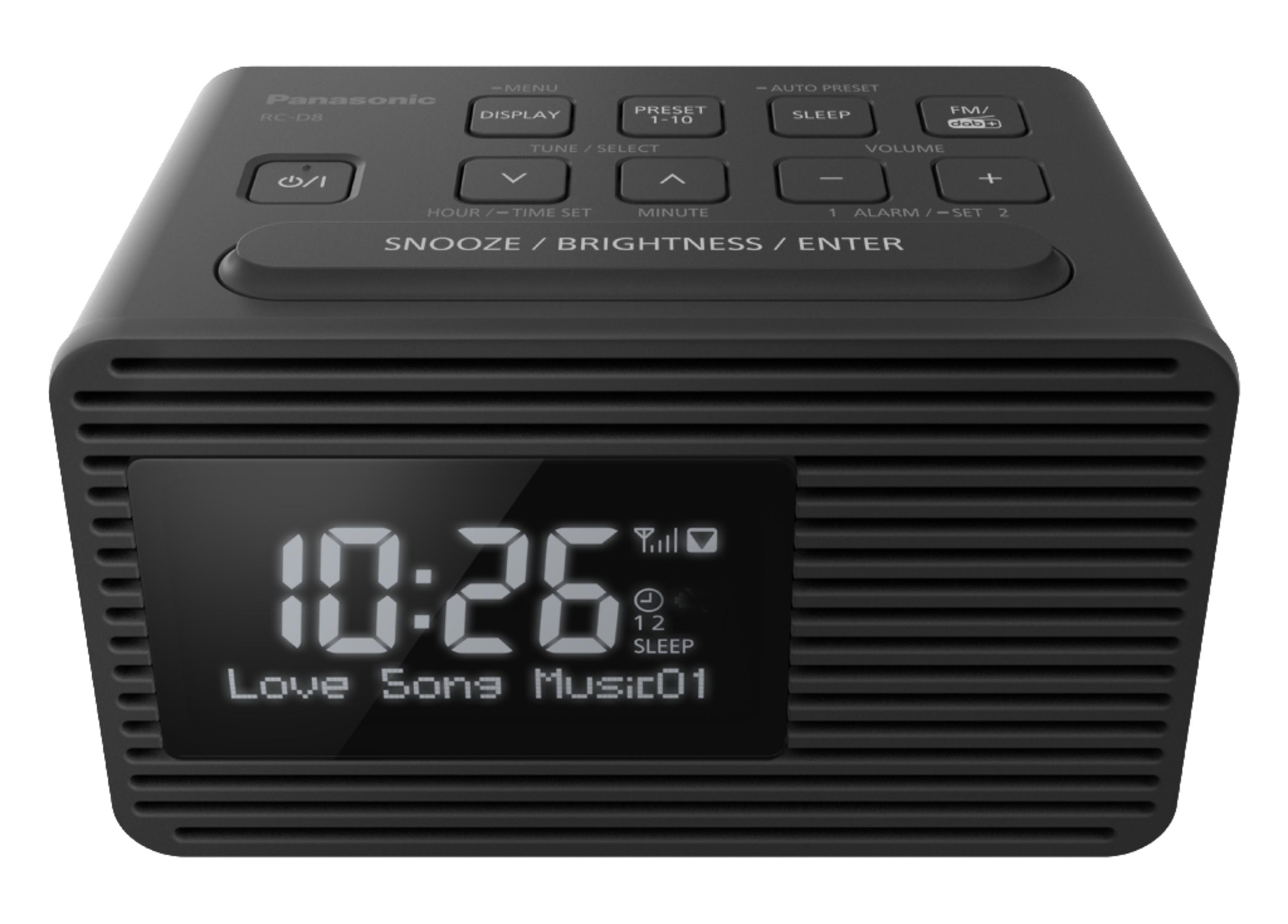 Sveglia digitale nera con display che mostra l'ora e le informazioni radio.