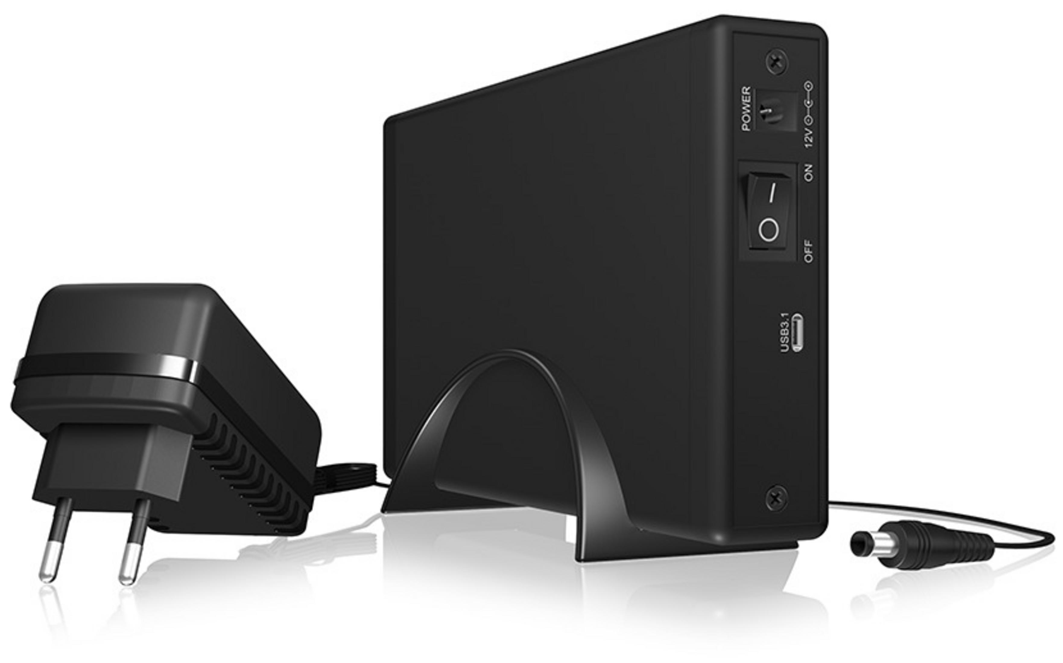Schwarzes elektronisches Gerät mit Netzteil. Netzschalter und USB-Anschluss sichtbar.
