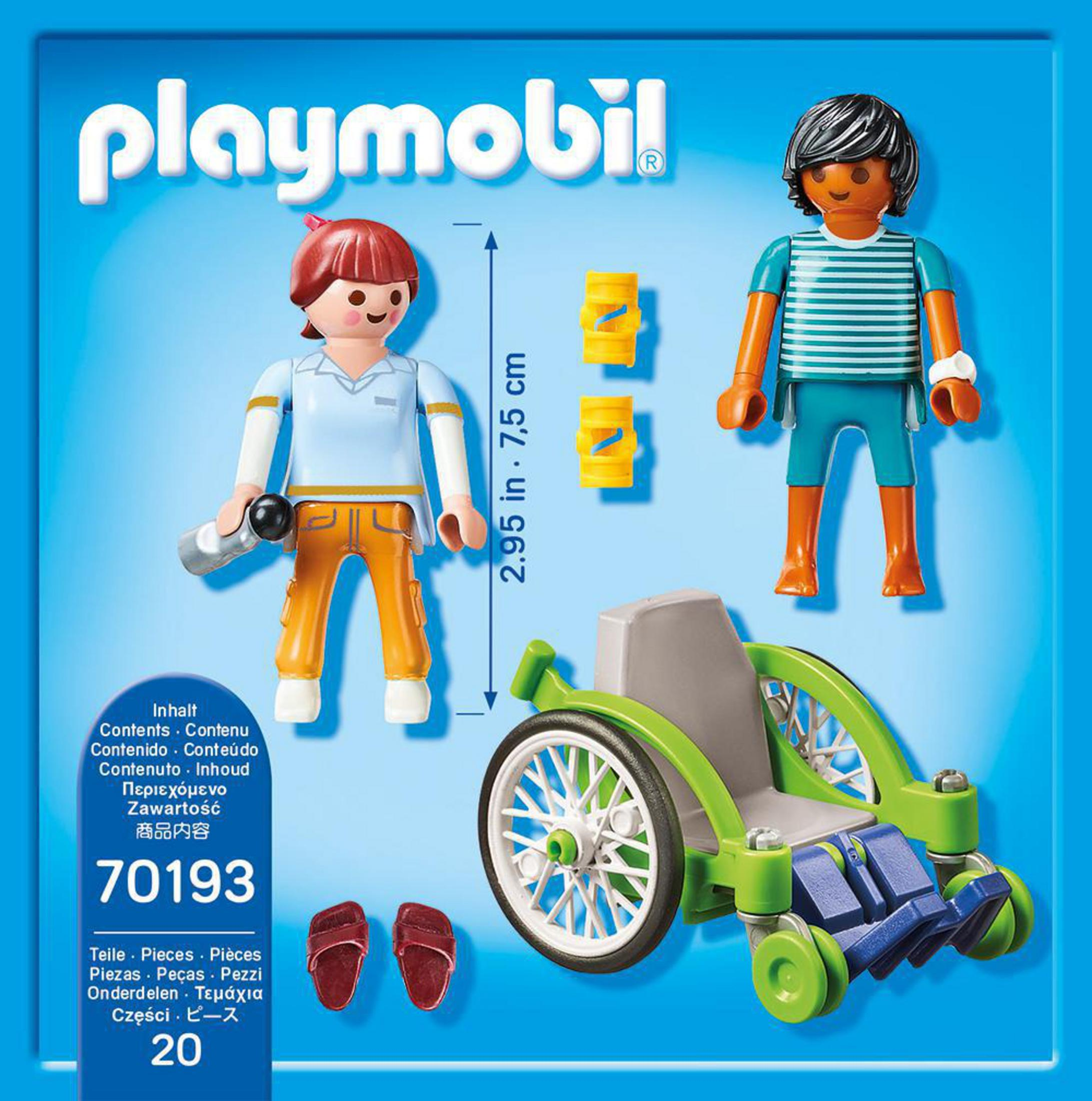 Ensemble Playmobil avec deux figurines, un fauteuil roulant et des accessoires. Comprend un conteneur avec contenu.