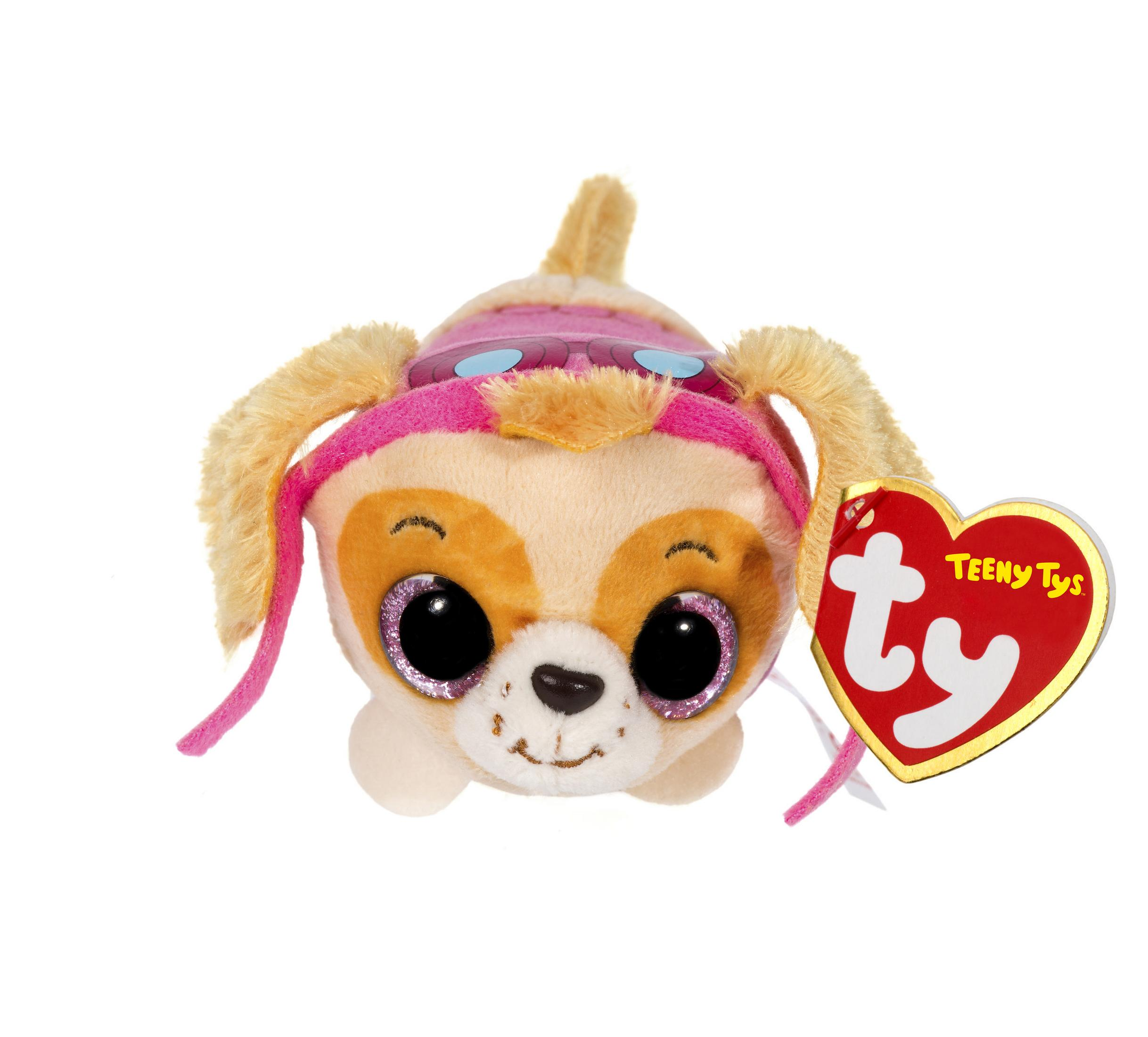 A stuffed puppy toy with big eyes and a heart-shaped tag.