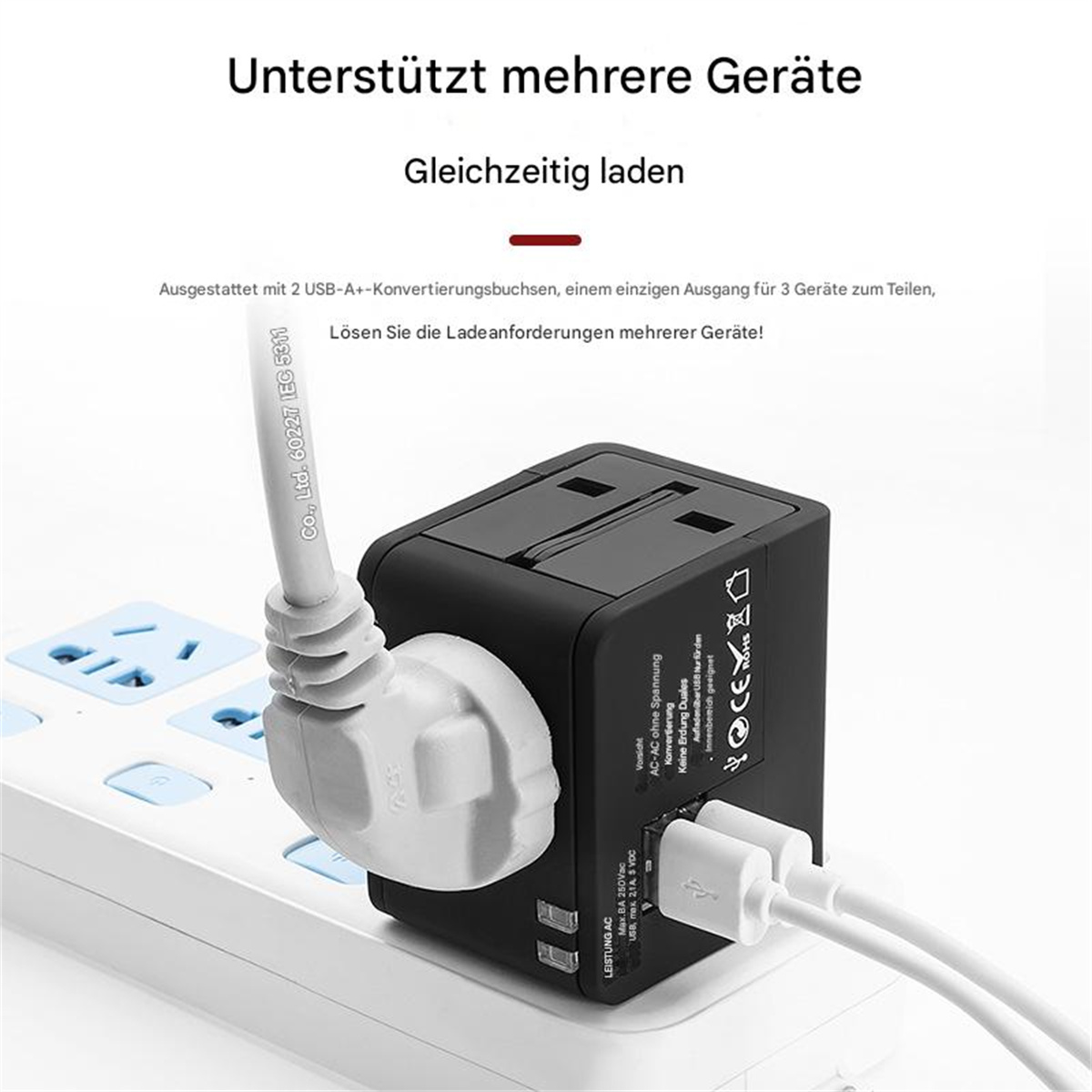 Schwarzer Netzadapter mit mehreren Anschlüssen, weißer Stecker mit Kabel und zwei weiße USB-Kabel.