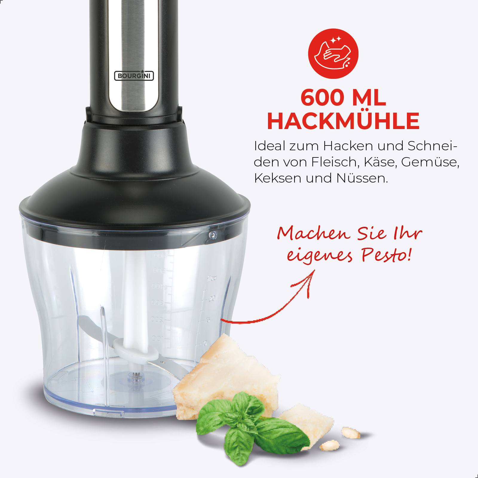 Czarny blender ręczny z przezroczystym pojemnikiem, bazylią i parmezanem.