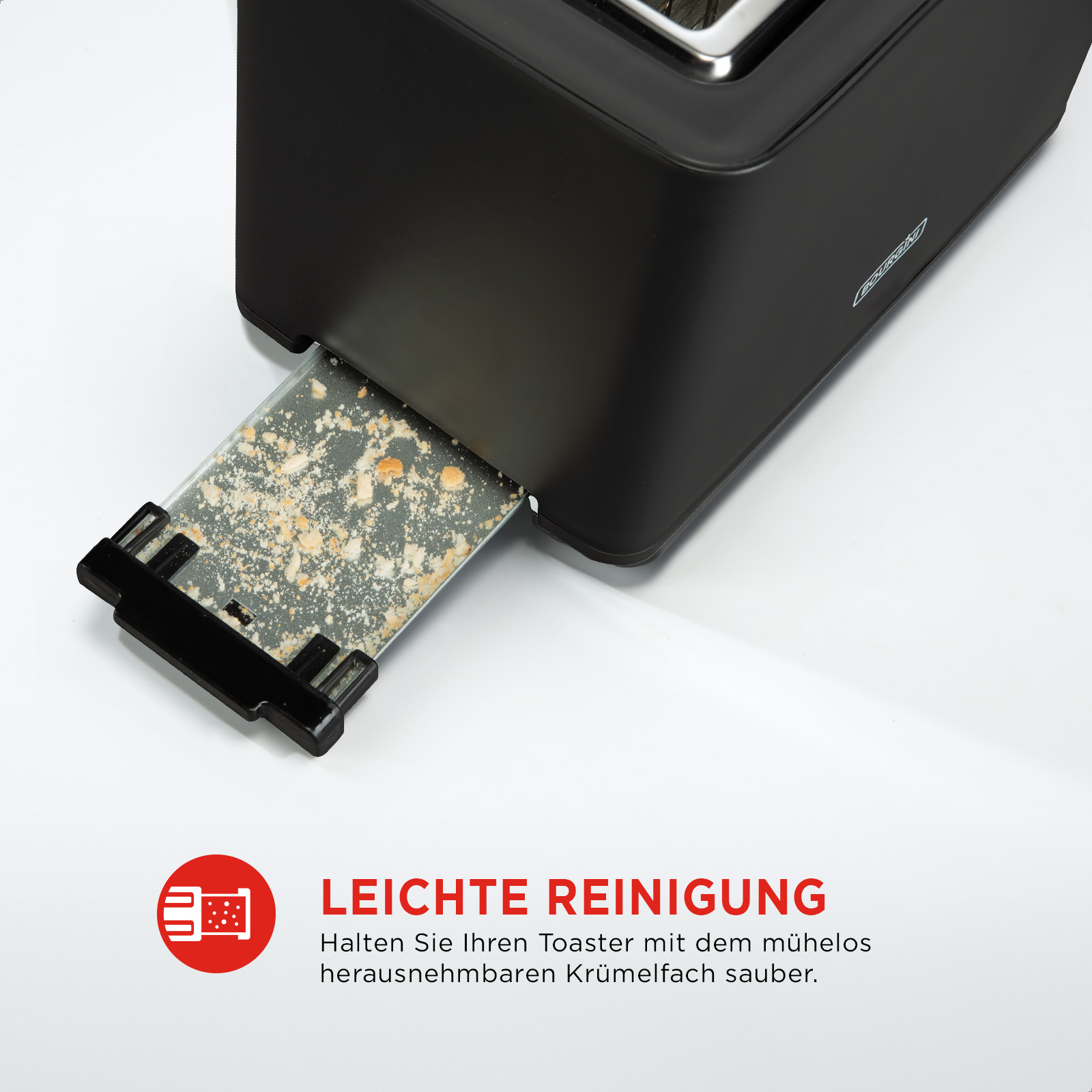 Czarny toster z wysuniętą szufladą na okruchy. Tekst: Łatwe czyszczenie. Toster stoi na białej powierzchni.