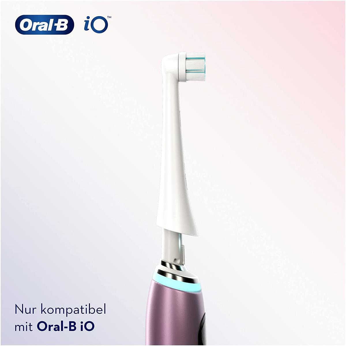 Elektrische Zahnbürste Oral-B iO mit weißem Bürstenkopf und rosa Griff.