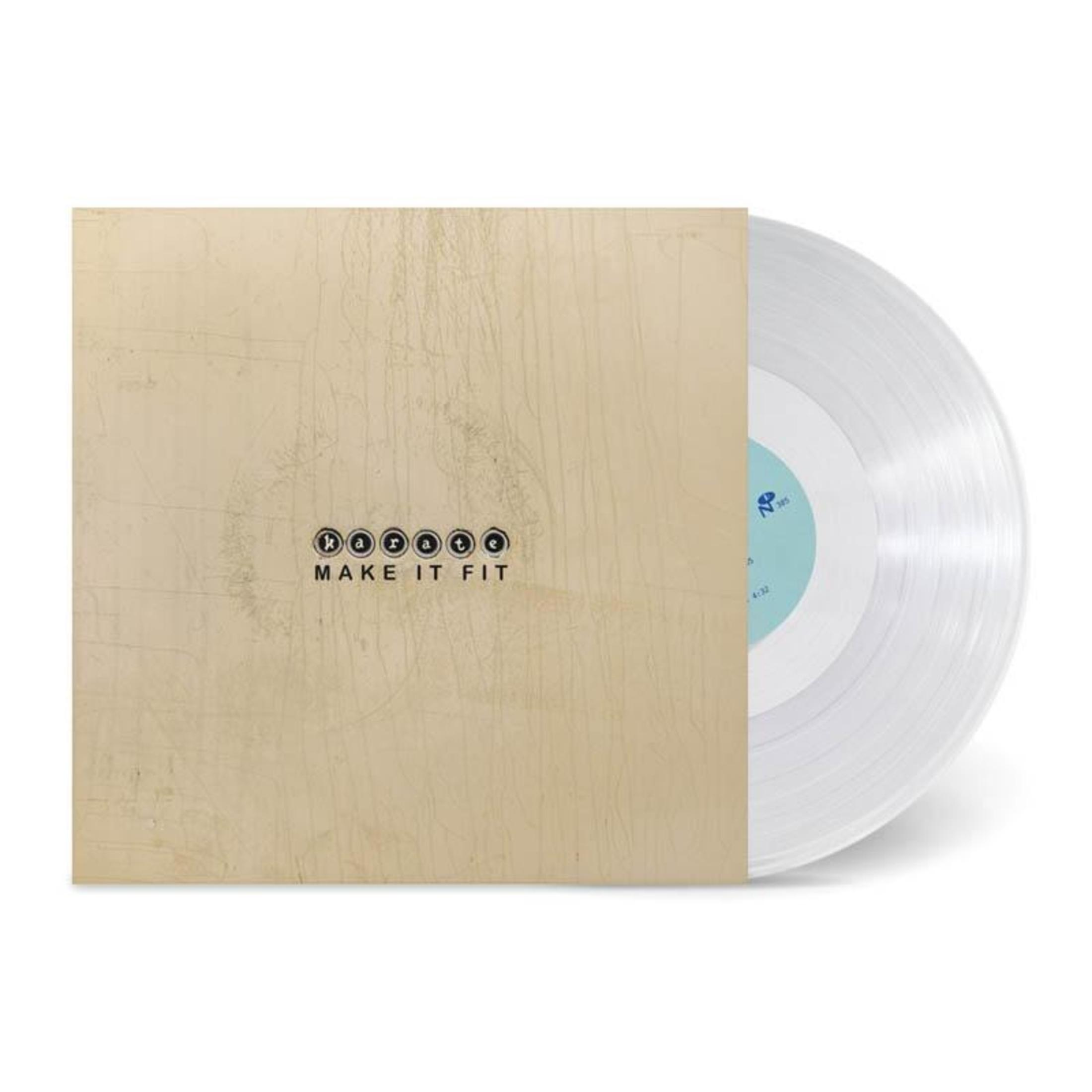 Disque vinyle dans une pochette. La pochette est de couleur claire avec les mots 'MAKE IT FIT'. Le vinyle est transparent.