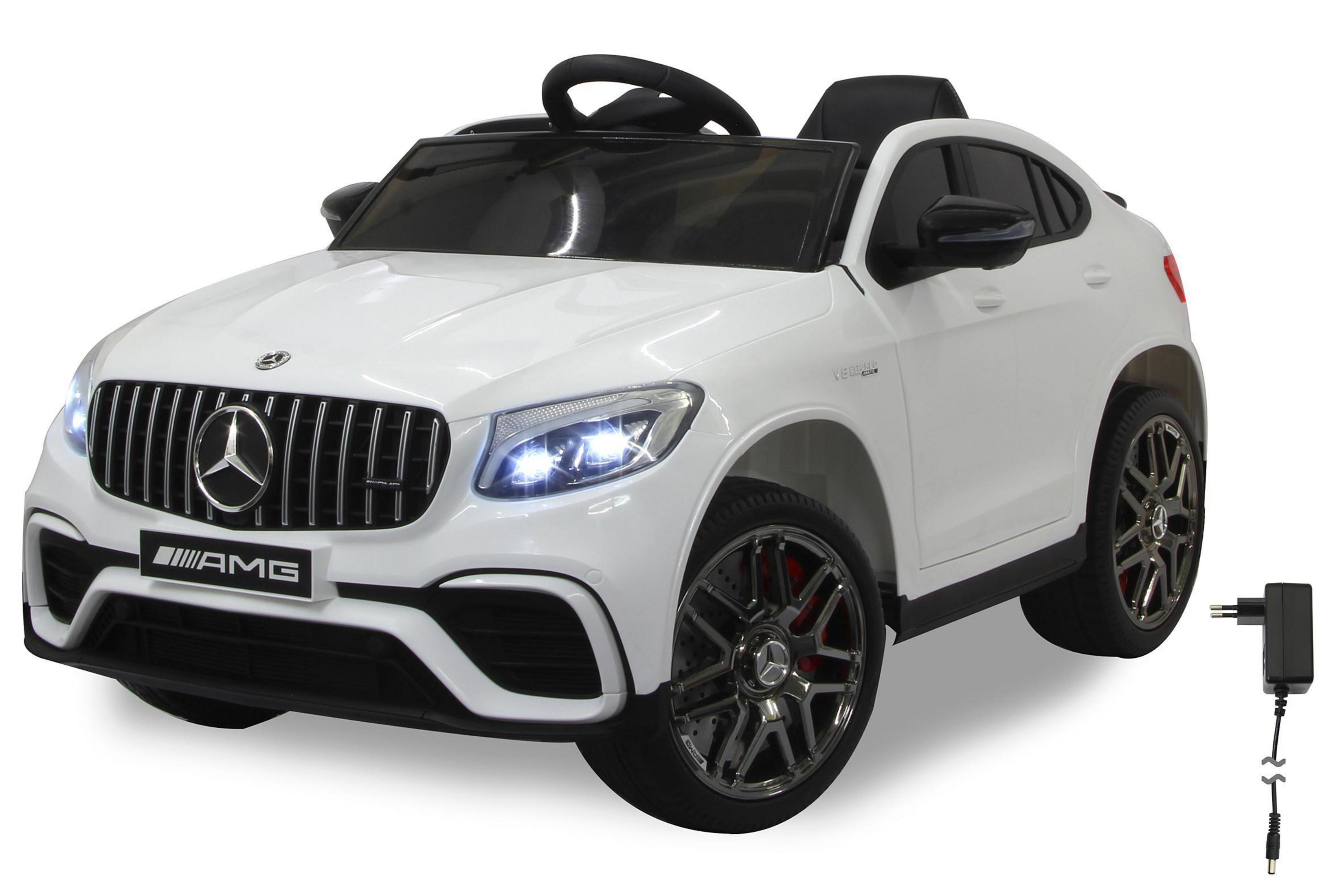 Weißes elektrisches Spielzeugauto mit schwarzen Akzenten. Zeigt die Vorderseite des Autos mit dem Mercedes-Logo.