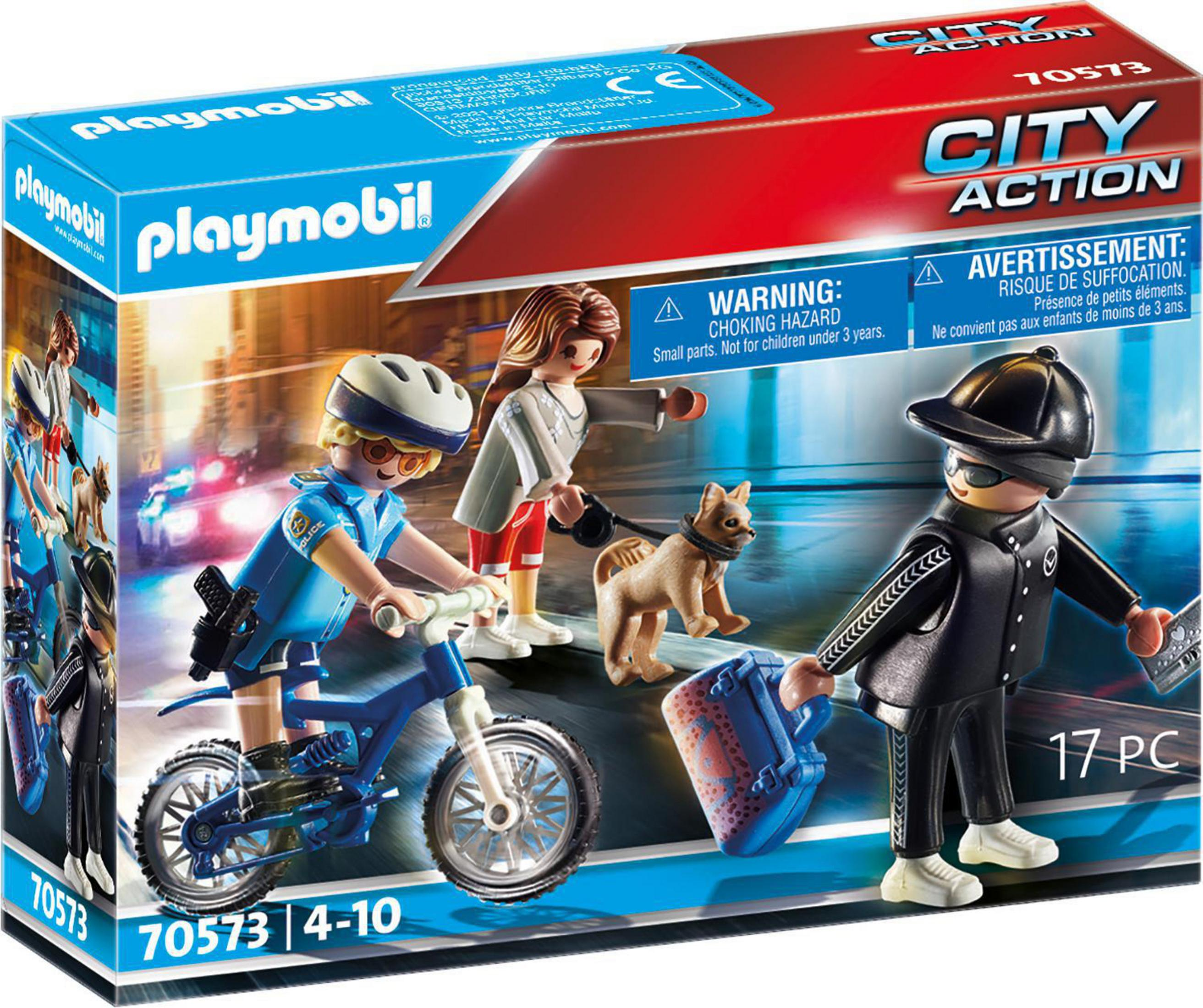 Scatola del set della polizia Playmobil. Mostra personaggi, auto della polizia e accessori. Sfondo bianco.