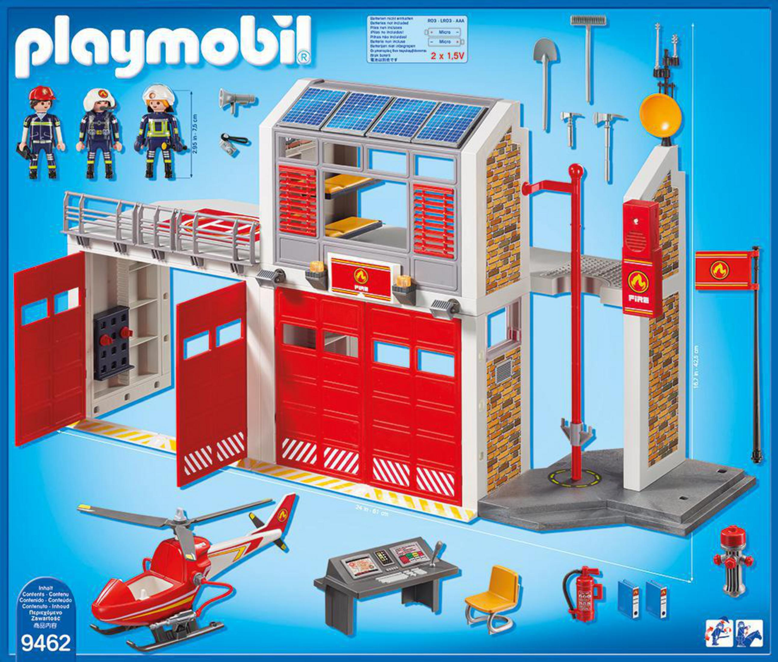 Set stazione dei pompieri Playmobil con edifici, personaggi, un elicottero e altri accessori.
