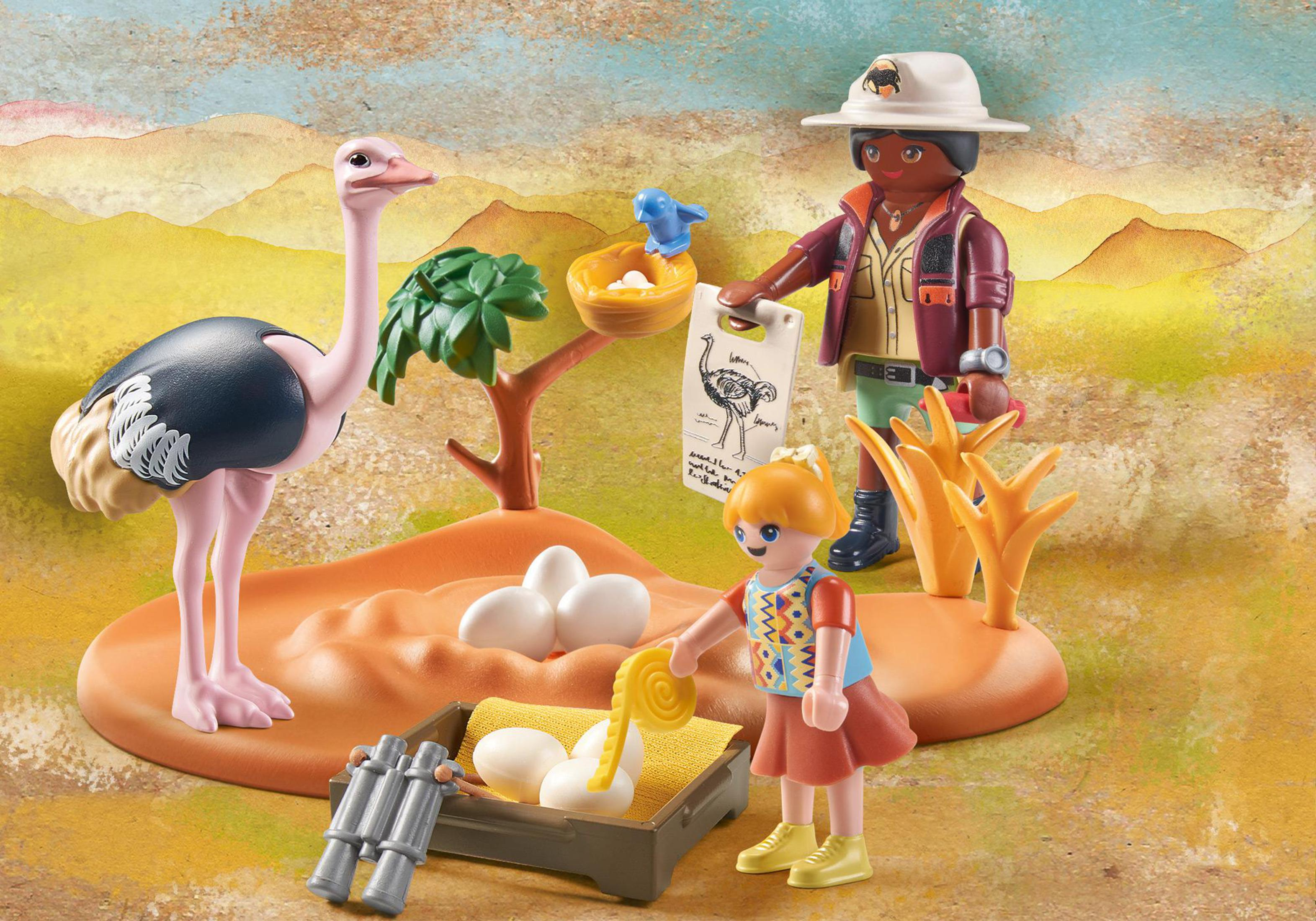 Eine Playmobil-Safari-Szene mit einem Strauß, Eiern, einem Zoologen und einem Kind. Die Szene ist eine Wüste.