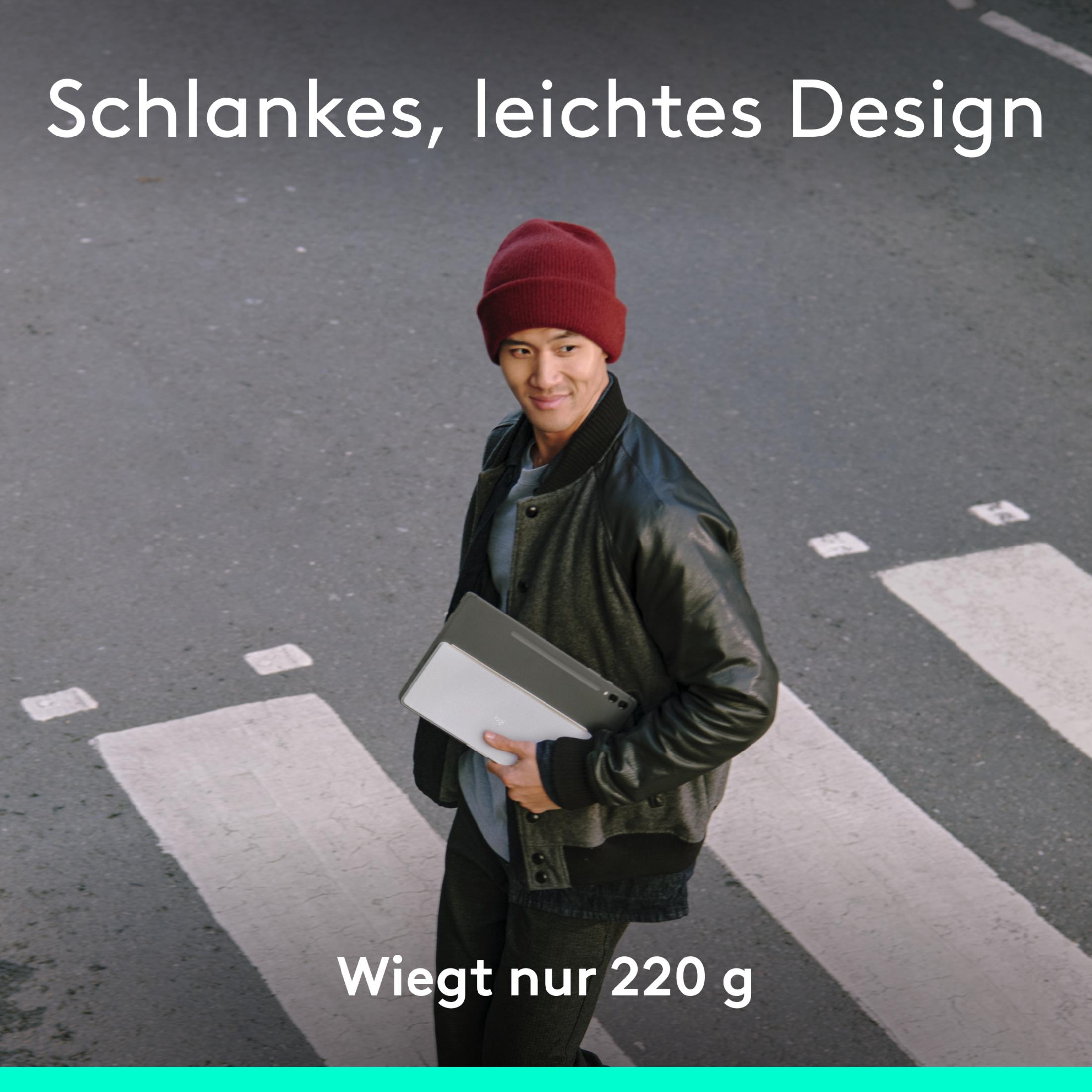 Mann überquert Zebrastreifen, hält Laptop. Text: Schlankes, leichtes Design. Wiegt nur 220 g.