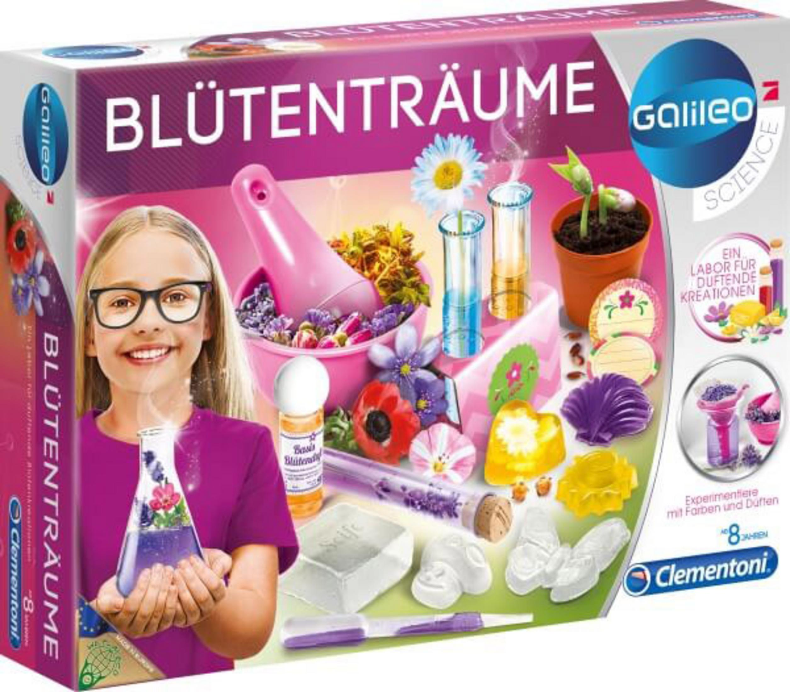Ein Mädchen mit Brille lächelt und hält eine Blumen-Kit-Box. Die Box enthält verschiedene wissenschaftliche Artikel.