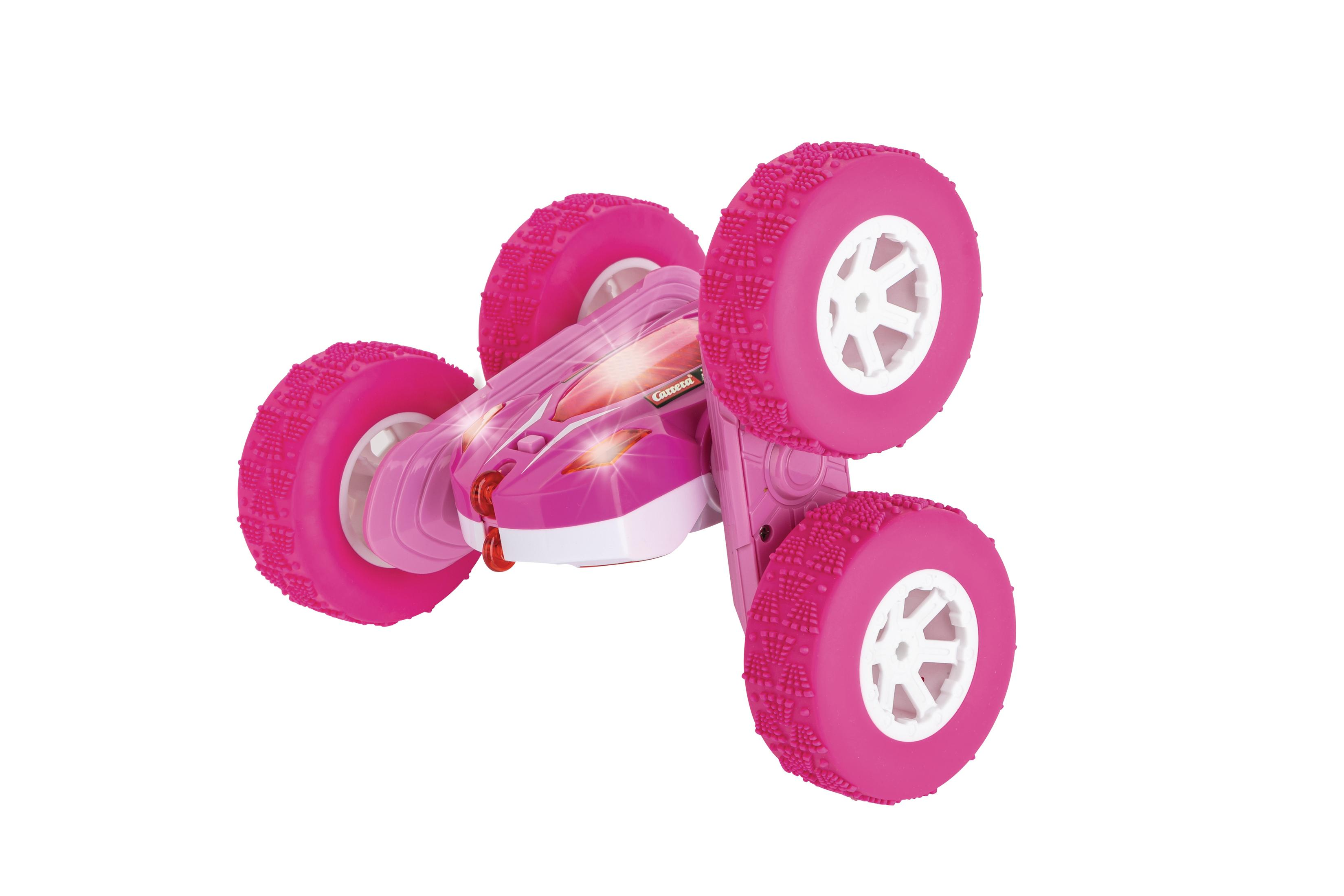 Un'auto giocattolo rosa con quattro ruote, progettata per le capriole. Ha luci e la scritta 'Carrera'.