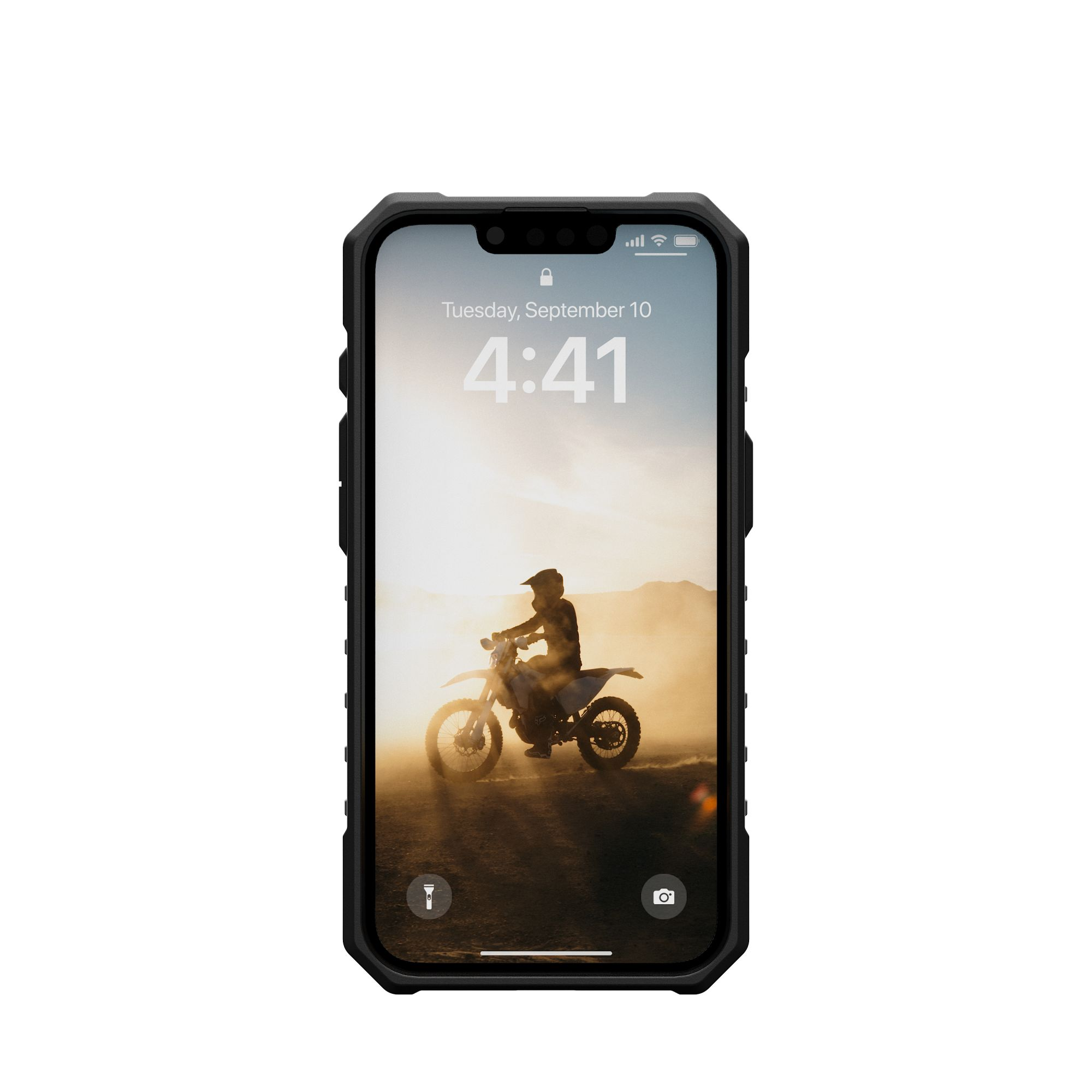 Ein Telefonbildschirm zeigt einen Dirtbike-Fahrer vor Sonnenuntergang.