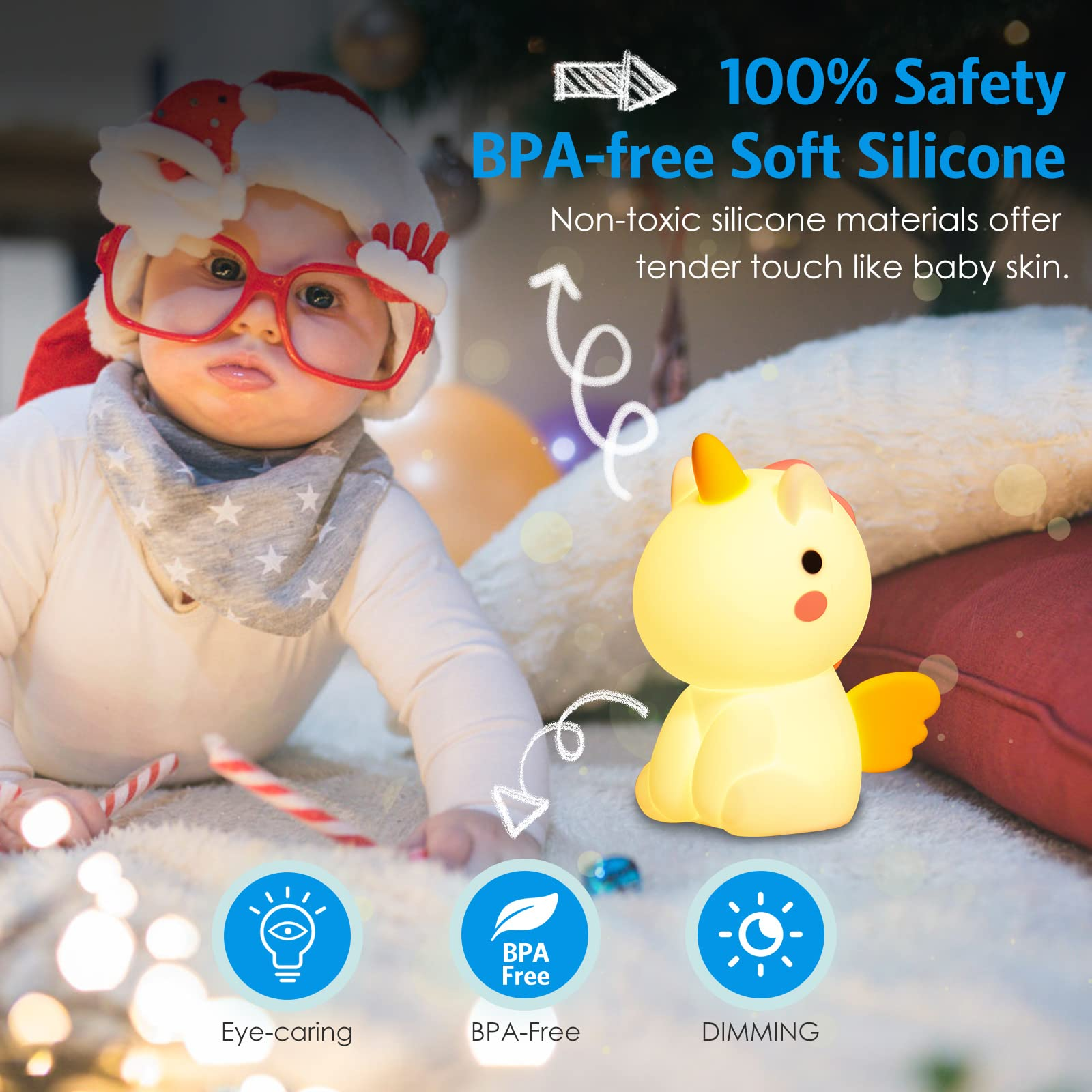 Ein Baby mit Weihnachtsmütze und Brille in der Nähe eines Einhorn-Nachtlichts und Kissen. Text: 'BPA-frei'.