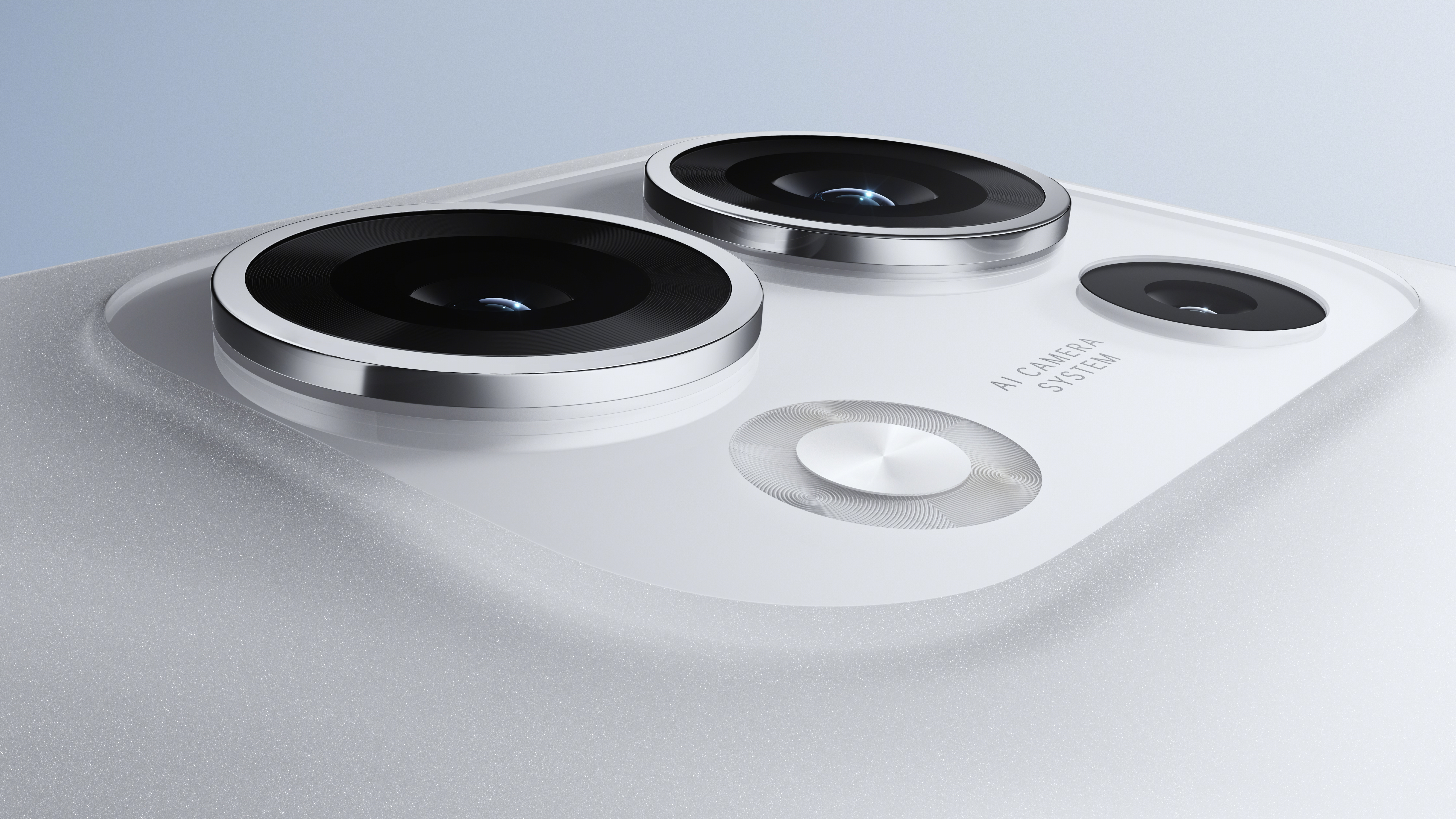 Close-up of a white phone with three camera lenses and the words 'AI CAMERA SYSTEM'. The phone is white.