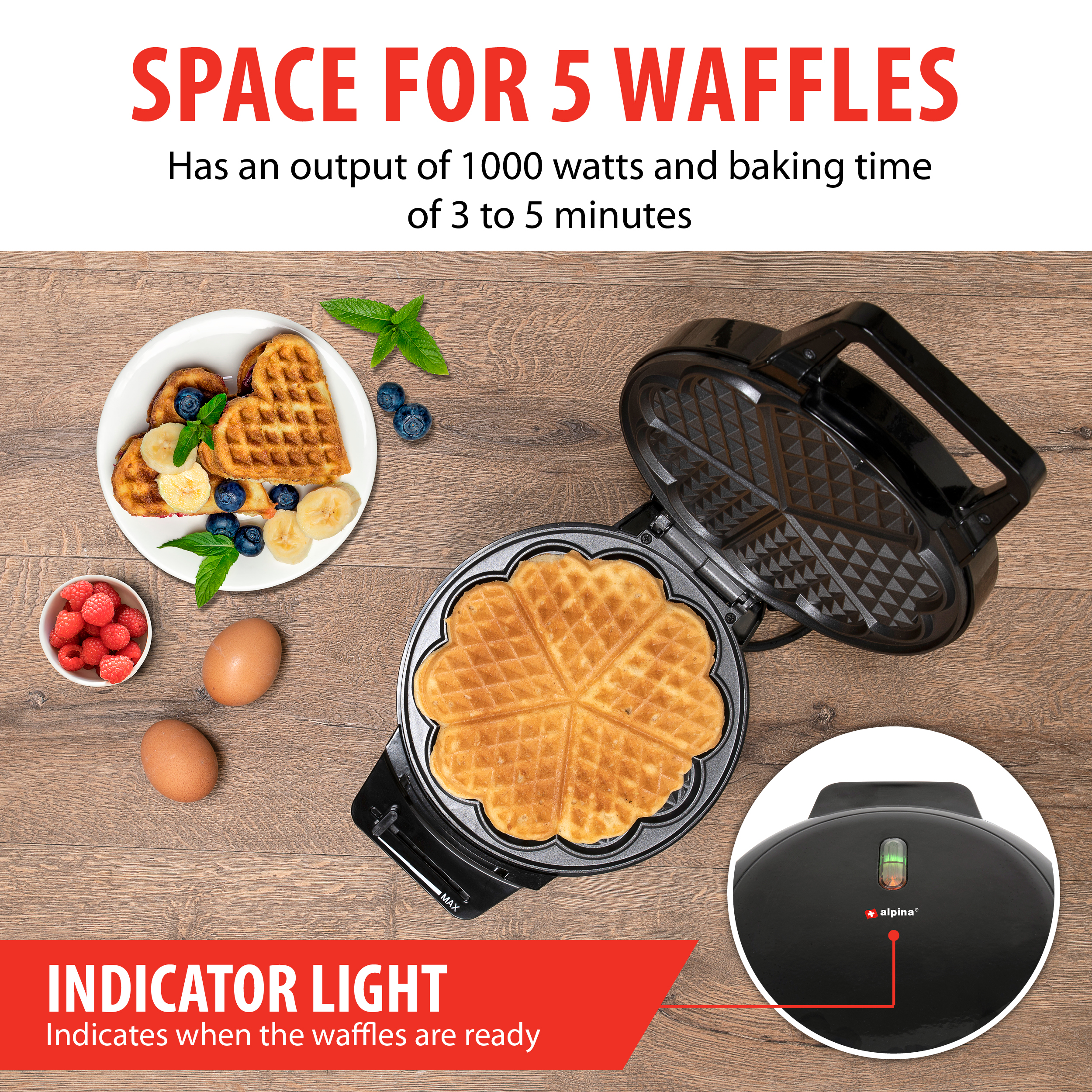 Waffle maker with waffles. Waffles are ready, with indicator light on. Eggs, berries and mint are nearby.