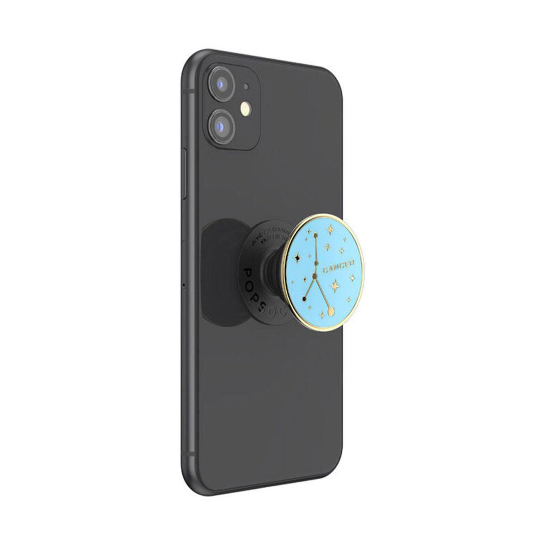 Schwarzes Telefon mit einem PopSocket mit Krebs-Sternzeichen.