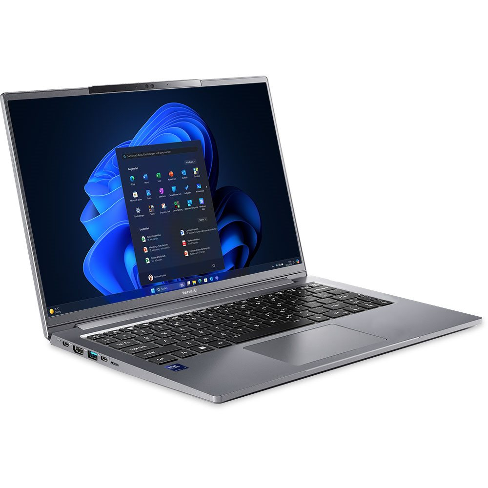 Laptop z interfejsem Windows, niebieskie tło.